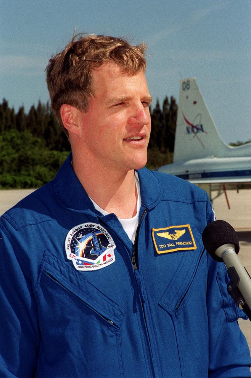 STS-100 Mission Specialist Scott E. Parazynski talks to the media after crew arrival at the Shuttle Landing Facility. The crew is getting ready for launch April 19. The 11-day mission to the International Space Station will deliver and integrate the Spacelab Logistics Pallet/Launch Deployment Assembly, which includes the Space Station Remote Manipulator system and the UHF Antenna, and the Multi-Purpose Logistics Module Raffaello. Liftoff on mission STS-100 is scheduled at 2:41 p.m. EDT