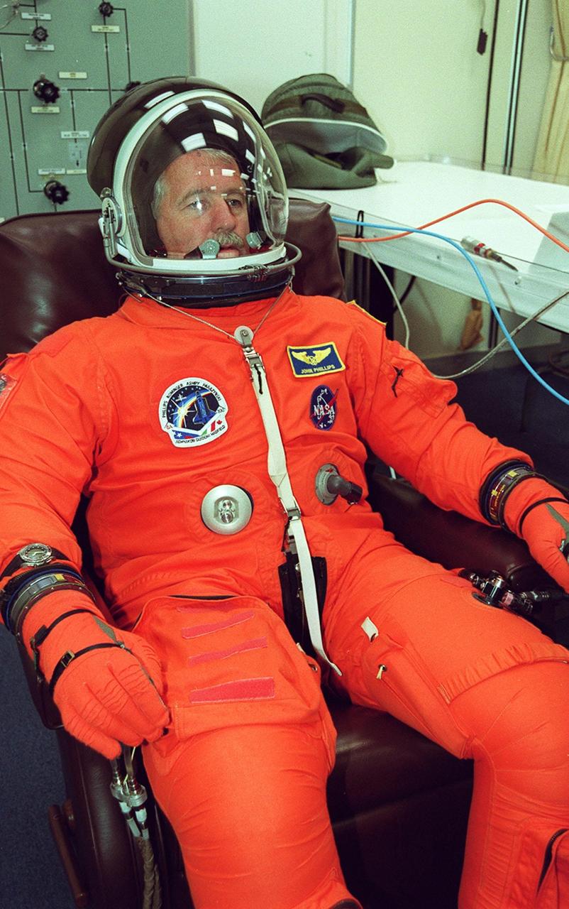 STS-100 Mission Specialist John L. Phillips is fully suited for launch. The 11-day mission to the International Space Station will deliver and integrate the Spacelab Logistics Pallet/Launch Deployment Assembly, which includes the Space Station Remote Manipulator system and the UHF Antenna, and the Multi-Purpose Logistics Module Raffaello. The mission includes two planned spacewalks for installation of the SSRMS. The mission is also the inaugural flight of Raffaello, carrying resupply stowage racks and resupply/return stowage platforms. Liftoff on mission STS-100 is scheduled at 2:41 p.m. EDT April 19