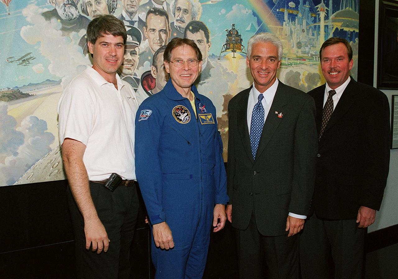 KENNEDY SPACE CENTER, FLA. -- Astronaut Sam Durrance (second from left) and State Education Commissioner Charlie Crist (third from left) pose with Kevin Brown (left), vice president of Command and Control Technologies, Inc., and Jerry Moyer, of Dynamac (Bionetics) at the Center for Space Education in the KSC Visitor Complex. Crist commemorated the 20th anniversary of the Shuttle program with his visit to watch the launch of Space Shuttle Endeavour on mission STS-100. He and Durrance accompanied students from Ronald McNair Magnet School, Cocoa, Fla., for the launch