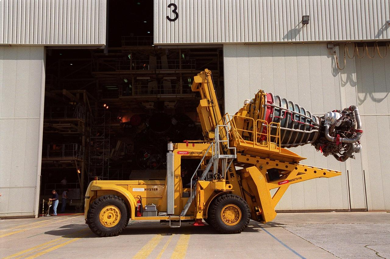 KENNEDY SPACE CENTER, FLA. -- The transport vehicle carrying a new block 2 engine arrives at Orbiter Processing Facility bay 3. There the new engine will be installed on the orbiter Atlantis, on mission STS-104, for its first flight. The Block II Main Engine configuration is manufactured by Boeing Rocketdyne in Canoga Park, Calif., and includes a new Pratt & Whitney high-pressure fuel turbo pump. Engine improvements are managed by NASA’s Marshall Space Flight Center in Huntsville, Ala. Each Space Shuttle Main Engine is 14 feet (4.3 meters) long, weighs about 7,000 pounds (3,175 kilograms), and is 7.5 feet (2.3 meters) in diameter at the end of the nozzle