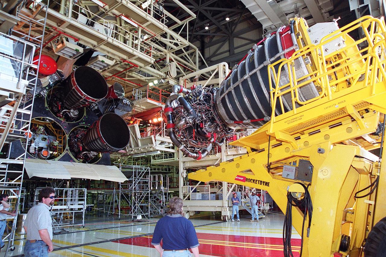 KENNEDY SPACE CENTER, FLA. -- A new block 2 engine heads toward Atlantis in Orbiter Processing Facility bay 3. There the new engine will be installed for its first flight on Atlantis, for mission STS-104. The Block II Main Engine configuration is manufactured by Boeing Rocketdyne in Canoga Park, Calif., and includes a new Pratt & Whitney high-pressure fuel turbo pump. Engine improvements are managed by NASA’s Marshall Space Flight Center in Huntsville, Ala. Each Space Shuttle Main Engine is 14 feet (4.3 meters) long, weighs about 7,000 pounds (3,175 kilograms), and is 7.5 feet (2.3 meters) in diameter at the end of the nozzle