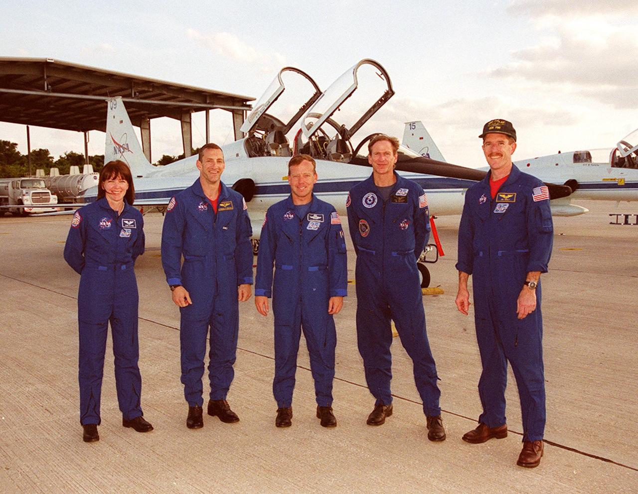 KENNEDY SPACE CENTER, FLA. -- After their arrival at the Shuttle Landing Facility, the STS-104 crew takes time to pose for a photo. Standing, left to right, are Mission Specialist Janet Kavandi, Pilot Charles Hobaugh, Commander Steven Lindsey, and Mission Specialists Michael Gernhardt and James Reilly. They are at KSC to continue Crew Equipment Interface Test activities such as payload familiarization. The airlock is the primary payload on their mission, scheduled to launch no earlier than June 14, 2001, from Launch Pad 39B