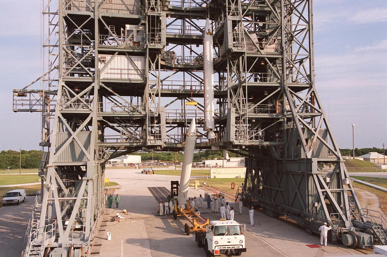 KENNEDY SPACE CENTER, FLA. -- A second solid rocket booster is lifted up the gantry at Launch Complex 17-B, Cape Canaveral Air Force Station. The SRBs will be mated to the Delta II rocket that will launch the MAP instrument into a lunar-assisted trajectory to the Sun-Earth for a 27-month mission. The MAP mission will examine conditions in the early universe by measuring temperature differences in cosmic microwave background radiation, which is the radiant heat left over from the Big Bang. The properties of this radiation directly reflect conditions in the early universe. MAP is scheduled to launch June 30 at 3:46:46 p.m. EDT