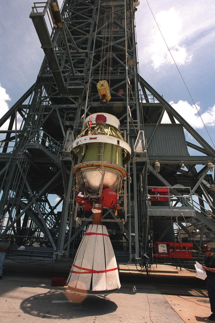 On Launch Complex 17-B, Cape Canaveral Air Force Station, the second stage of a Boeing Delta 7425-10 rocket is lifted into position as preparations to launch NASA's Microwave Anisotropy Probe (MAP) on June 30 continue. The launch will place MAP into a lunar-assisted trajectory to the Sun-Earth for a 27-month mission.; The probe will measure small fluctuations in the temperature of the cosmic microwave background radiation to an accuracy of one millionth of a degree. These measurements should reveal the size, matter content, age, geometry and fate of the universe. They will also reveal the primordial structure that grew to form galaxies and will test ideas about the origins of these primordial structures. The MAP instrument will be continuously shaded from the Sun, Earth, and Moon by the spacecraft. The probe is a product of Goddard Space Flight Center in partnership with Princeton University