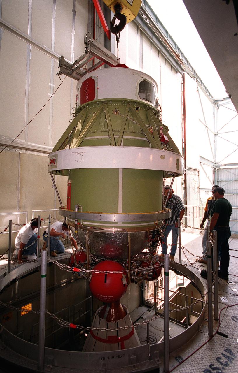 On Launch Complex 17-B, Cape Canaveral Air Force Station, the second stage of a Boeing Delta 7425-10 rocket is lifted into position as preparations to launch NASA's Microwave Anisotropy Probe (MAP) on June 30 continue. The launch will place MAP into a lunar-assisted trajectory to the Sun-Earth for a 27-month mission.; The probe will measure small fluctuations in the temperature of the cosmic microwave background radiation to an accuracy of one millionth of a degree. These measurements should reveal the size, matter content, age, geometry and fate of the universe. They will also reveal the primordial structure that grew to form galaxies and will test ideas about the origins of these primordial structures. The MAP instrument will be continuously shaded from the Sun, Earth, and Moon by the spacecraft. The probe is a product of Goddard Space Flight Center in partnership with Princeton University