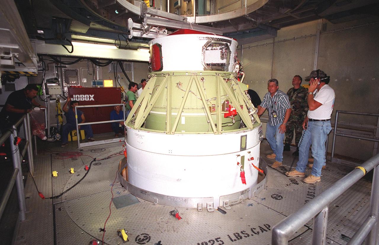 KENNEDY SPACE CENTER, FLA. -- On Launch Complex 17-B, Cape Canaveral Air Force Station, the second stage of a Boeing Delta 7425-10 rocket is lifted into position as preparations to launch NASA's Microwave Anisotropy Probe (MAP) on June 30 continue. The launch will place MAP into a lunar-assisted trajectory to the Sun-Earth for a 27-month mission.; The probe will measure small fluctuations in the temperature of the cosmic microwave background radiation to an accuracy of one millionth of a degree. These measurements should reveal the size, matter content, age, geometry and fate of the universe. They will also reveal the primordial structure that grew to form galaxies and will test ideas about the origins of these primordial structures. The MAP instrument will be continuously shaded from the Sun, Earth, and Moon by the spacecraft. The probe is a product of Goddard Space Flight Center in partnership with Princeton University
