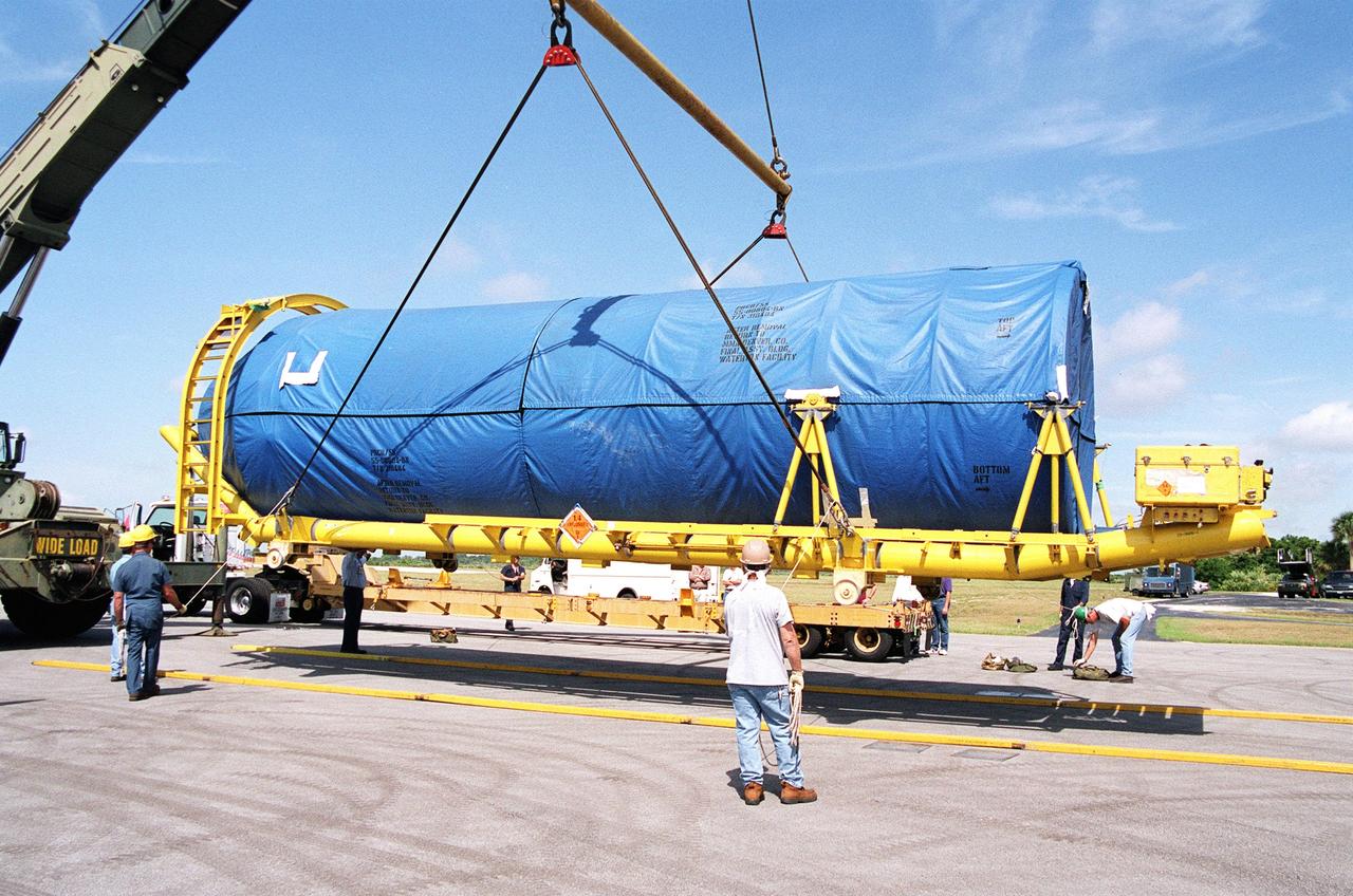 Workers supervise the off-loading of segments of a Lockheed Martin Atlas II rocket at the Skid Strip at Cape Canaveral Air Force Station.; The rocket will be used to launch the Geostationary Operational Environmental Satellite-M (GOES-M), the latest in the current series of advanced geostationary weather satellites in service.; GOES-M is being prepared for launch at the Astrotech Space Operations facility located in the Spaceport Florida Industrial Park in Titusville, Fla. The launch is scheduled for July 15 from Pad 36-A, Cape Canaveral Air Force Station