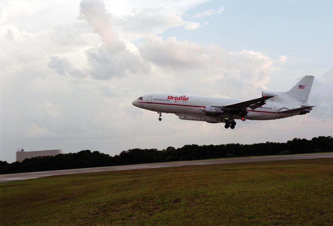 KENNEDY SPACE CENTER, Fla. -- An L-1011 aircraft called the Stargazer gets ready to land at the Skid Strip, Cape Canaveral Air Force Station. Underneath its belly it carries the Orbital Sciences Corp. Pegasus XL launch vehicle with the High Energy Solar Spectroscopic Imager (HESSI) attached. The Pegasus XL will launch the HESSI no earlier than June 12 from CCAFS. The primary mission of HESSI is to explore the basic physics of particle acceleration and energy release in solar flares