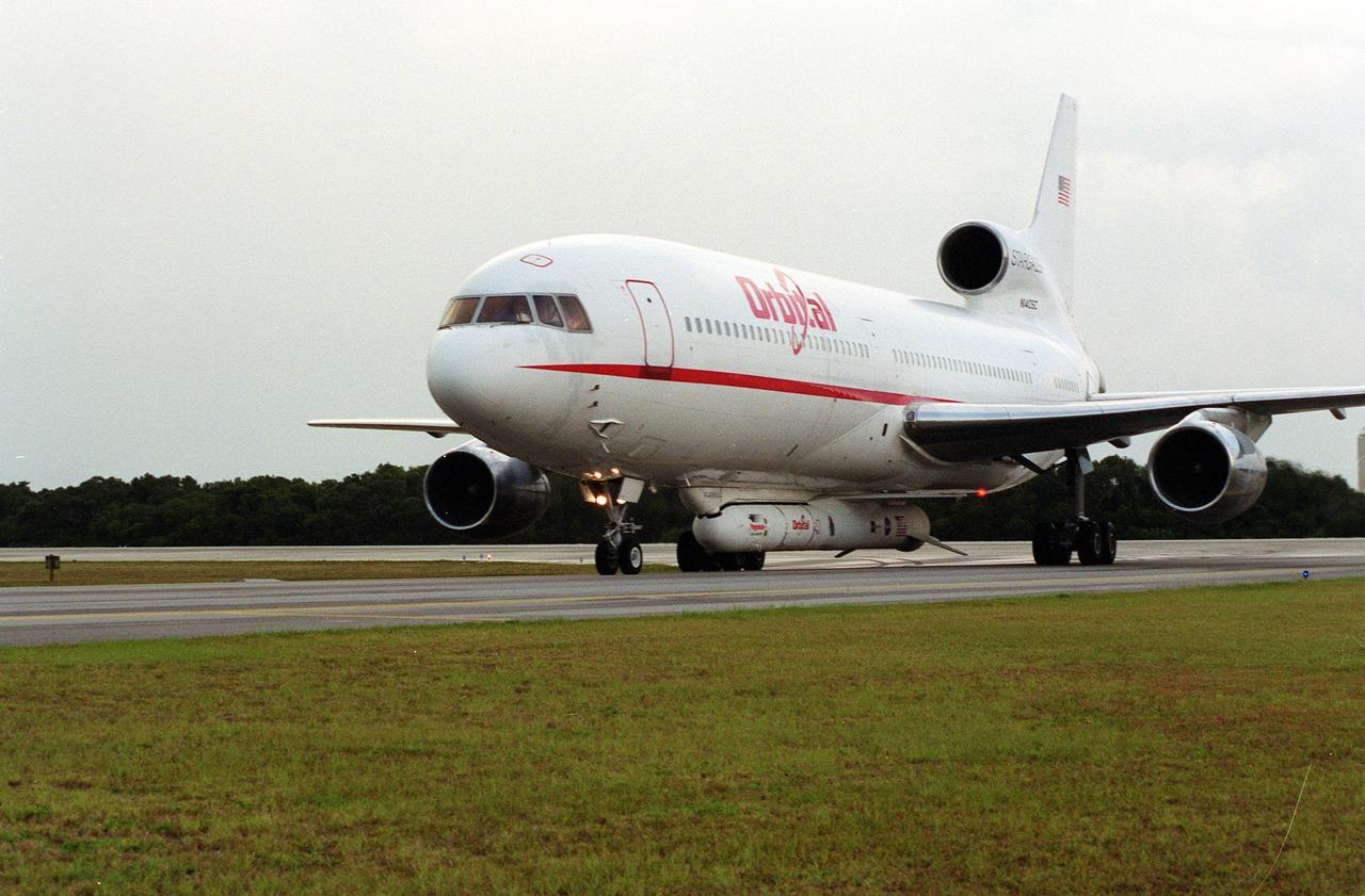 KENNEDY SPACE CENTER, Fla. -- An L-1011 aircraft called the Stargazer lands at the Skid Strip, Cape Canaveral Air Force Station. Underneath its belly it carries the Orbital Sciences Corp. Pegasus XL launch vehicle with the High Energy Solar Spectroscopic Imager (HESSI) attached. The Pegasus XL will launch the HESSI no earlier than June 12 from CCAFS. The primary mission of HESSI is to explore the basic physics of particle acceleration and energy release in solar flares