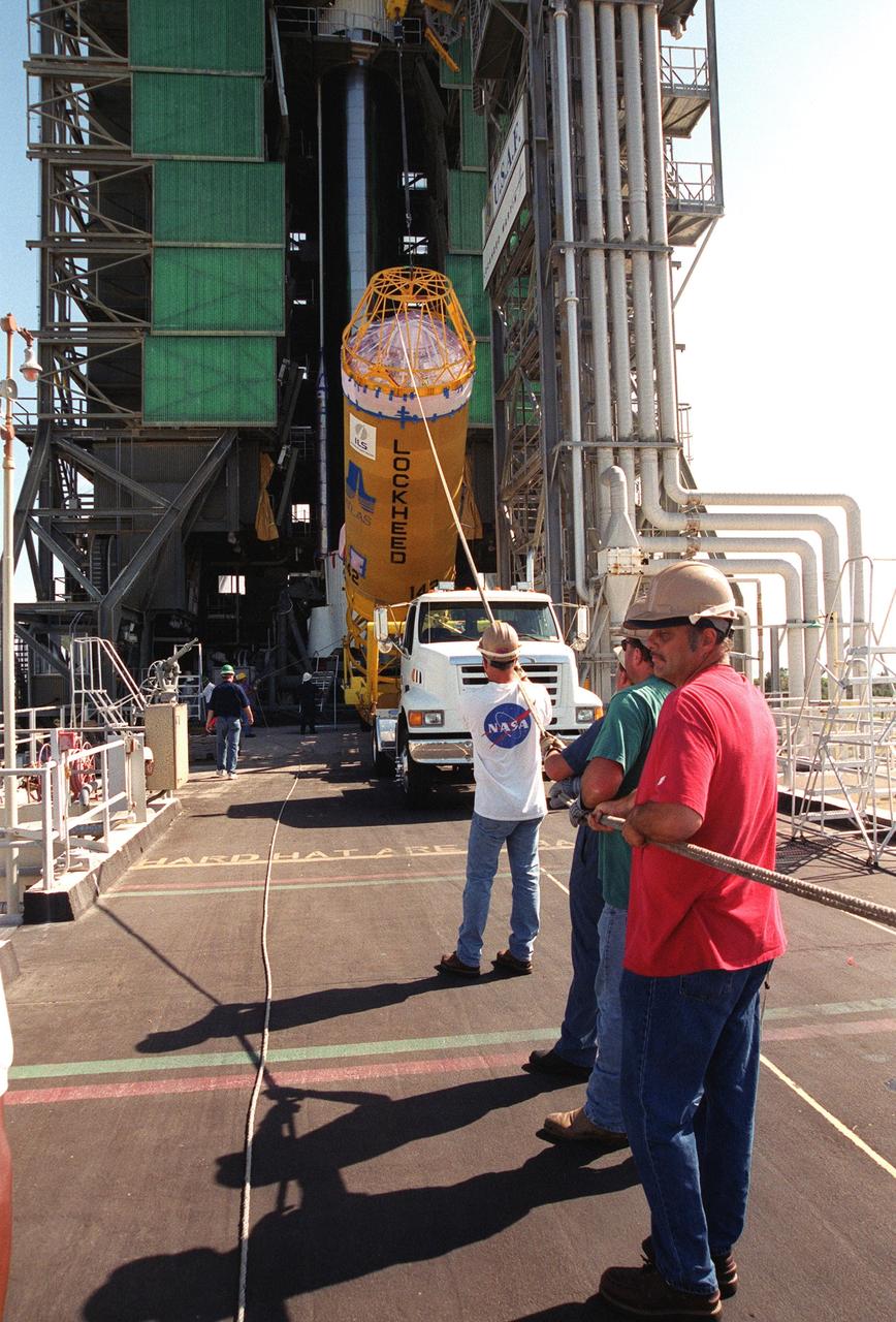KENNEDY SPACE CENTER, Fla. -- At Complex 36-A, Cape Canaveral Air Force Station, the second stage of the Geostationary Operational Environmental Satellite-M (GOES-M) Atlas II rocket is lifted from the transporter. It will be raised to vertical and lifted up the gantry for mating with the first stage. The last in the current series of advanced geostationary weather satellites in service, GOES-M has a new instrument not on earlier spacecraft, a Solar X-ray Imager that can be used in forecasting space weather, the effects of solar storms that create electromagnetic disturbances on earth that affect other satellites, communications and power grids. GOES-M is scheduled to launch from Cape Canaveral Air Force Station July 15