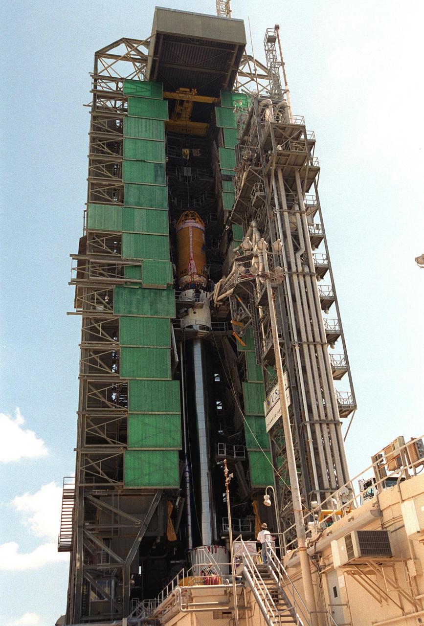 KENNEDY SPACE CENTER, Fla. -- At Complex 36-A, Cape Canaveral Air Force Station, the second stage of the Geostationary Operational Environmental Satellite-M (GOES-M) Atlas II rocket nears the top of the gantry. It will be mated with the first stage. The last in the current series of advanced geostationary weather satellites in service, GOES-M has a new instrument not on earlier spacecraft, a Solar X-ray Imager that can be used in forecasting space weather, the effects of solar storms that create electromagnetic disturbances on earth that affect other satellites, communications and power grids. GOES-M is scheduled to launch from Cape Canaveral Air Force Station July 15