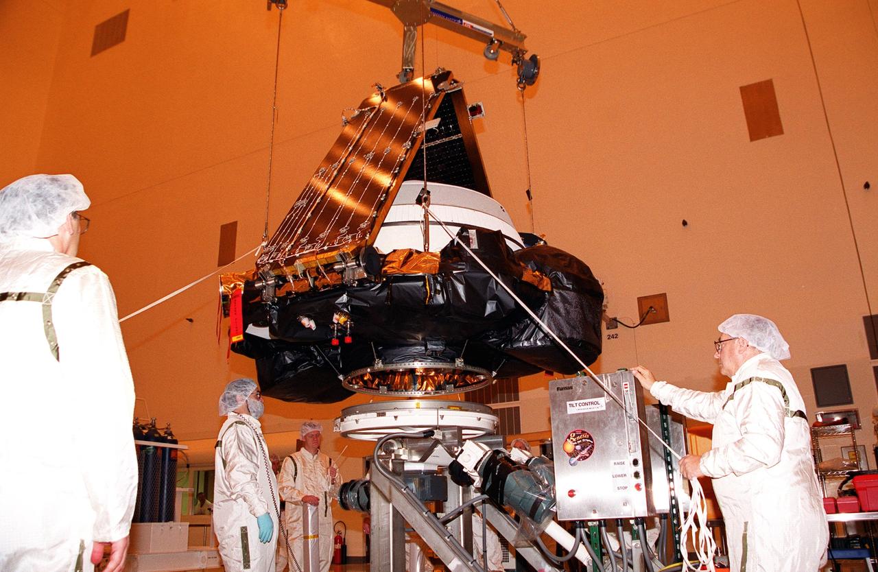 KENNEDY SPACE CENTER, Fla. -- In the Payload Hazardous Servicing Facility, the Genesis spacecraft is moved to a workstand. Genesis is designed to collect samples of solar wind particles and return them to Earth so that scientists can study the exact composition of the Sun and probe the solar system’s origin. On the workstand, the spacecraft will undergo processing, which includes a functional test, electrical systems test and deployment of the solar arrays. Genesis is scheduled to be launched on a Delta II Lite launch vehicle from Complex 17-A, Cape Canaveral Air Force Station, July 30, at 12:36 p.m. EDT