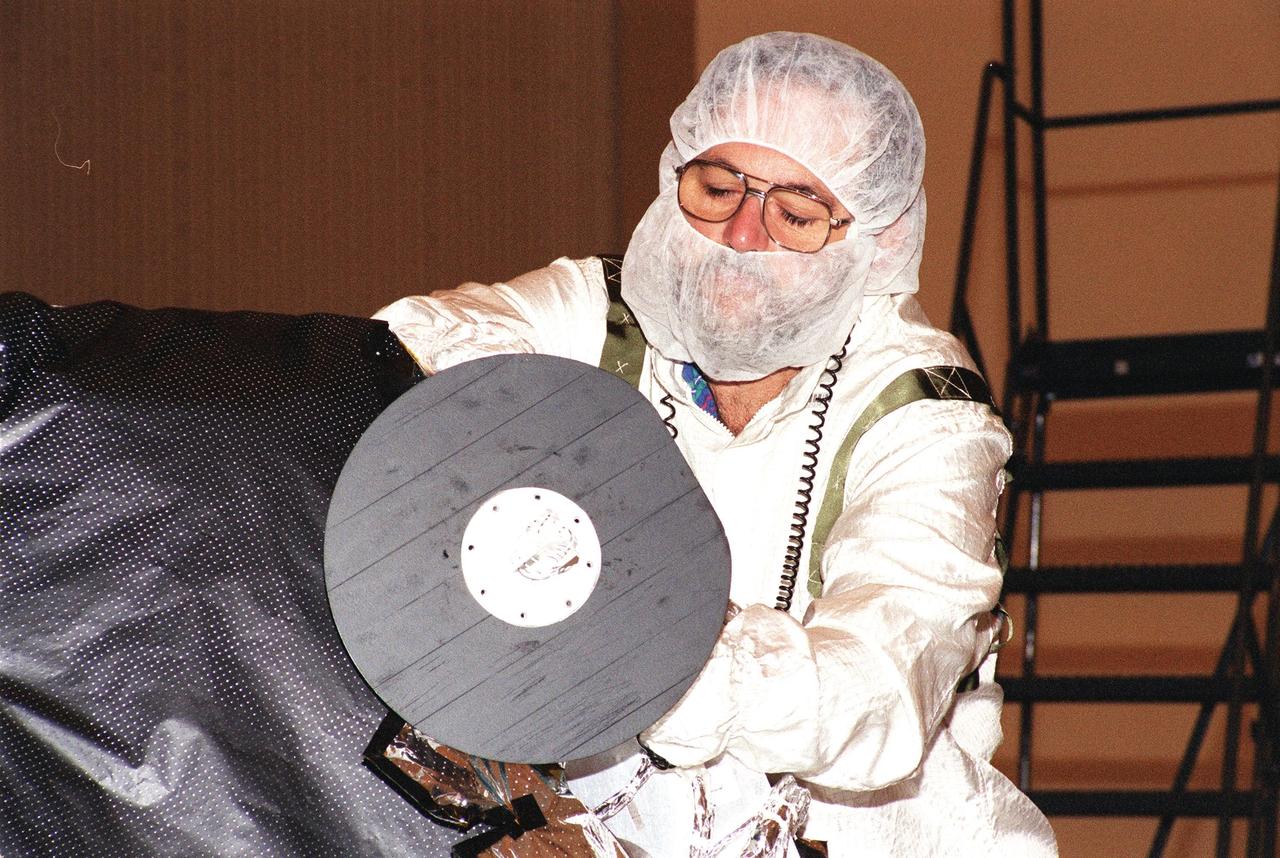 KENNEDY SPACE CENTER, Fla. -- An S-band medium gain antenna is installed on NASA's Genesis spacecraft in the Payload Hazardous Servicing Facility in KSC's industrial area.  The spacecraft is undergoing final preparations for its launch aboard a Boeing Delta II rocket on July 30 at 12:36 p.m. EDT.   Genesis will capture samples of the ions and elements in the solar wind and return them to Earth for scientists to use to determine the exact composition of the Sun and the solar system's origin. NASA's Genesis project is managed by the Jet Propulsion Laboratory in Pasadena, Calif.  Lockheed Martin Astronautics built the Genesis spacecraft for NASA in Denver, Colo
