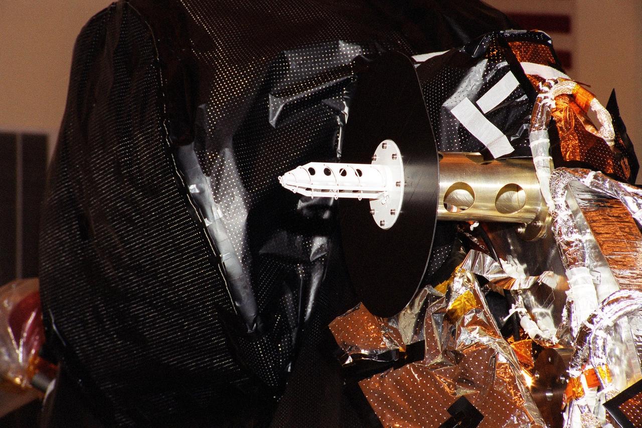 KENNEDY SPACE CENTER, Fla. -- An S-band medium gain antenna is installed on NASA's Genesis spacecraft in the Payload Hazardous Servicing Facility in KSC's industrial area.  The spacecraft is undergoing final preparations for its launch aboard a Boeing Delta II rocket on July 30 at 12:36 p.m. EDT.   Genesis will capture samples of the ions and elements in the solar wind and return them to Earth for scientists to use to determine the exact composition of the Sun and the solar system's origin. NASA's Genesis project is managed by the Jet Propulsion Laboratory in Pasadena, Calif.  Lockheed Martin Astronautics built the Genesis spacecraft for NASA in Denver, Colo