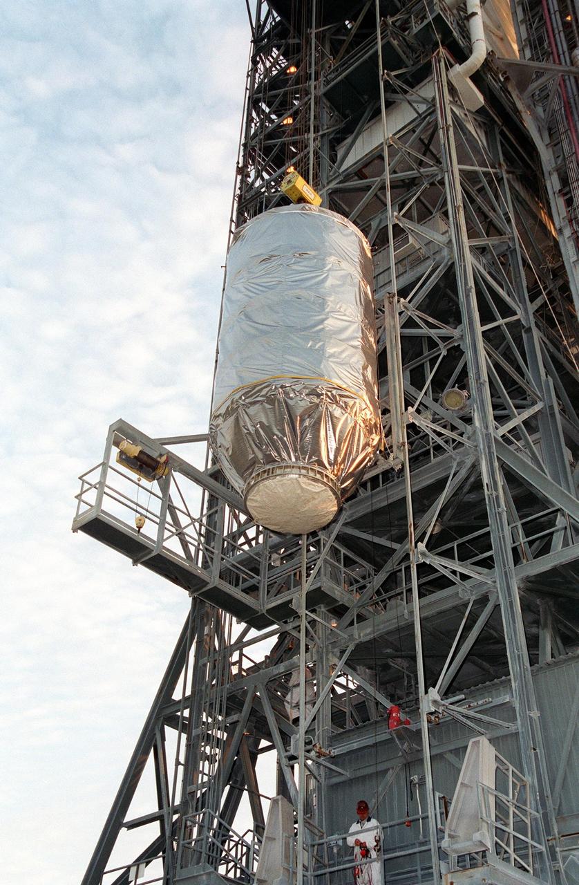 KENNEDY SPACE CENTER, Fla. -- The Microwave Anisotropy Probe (MAP) spacecraft is lifted up the gantry on Launch Complex 17-B, Cape Canaveral Air Force Station, where it will undergo final testing and installation of the payload fairing. Launch of MAP via a Boeing Delta II rocket is scheduled for June 30. The launch will place MAP into a lunar-assisted trajectory to the Sun-Earth for a 27-month mission. The probe will measure small fluctuations in the temperature of the cosmic microwave background radiation to an accuracy of one millionth of a degree. These measurements should reveal the size, matter content, age, geometry and fate of the universe. They will also reveal the primordial structure that grew to form galaxies and will test ideas about the origins of these primordial structures