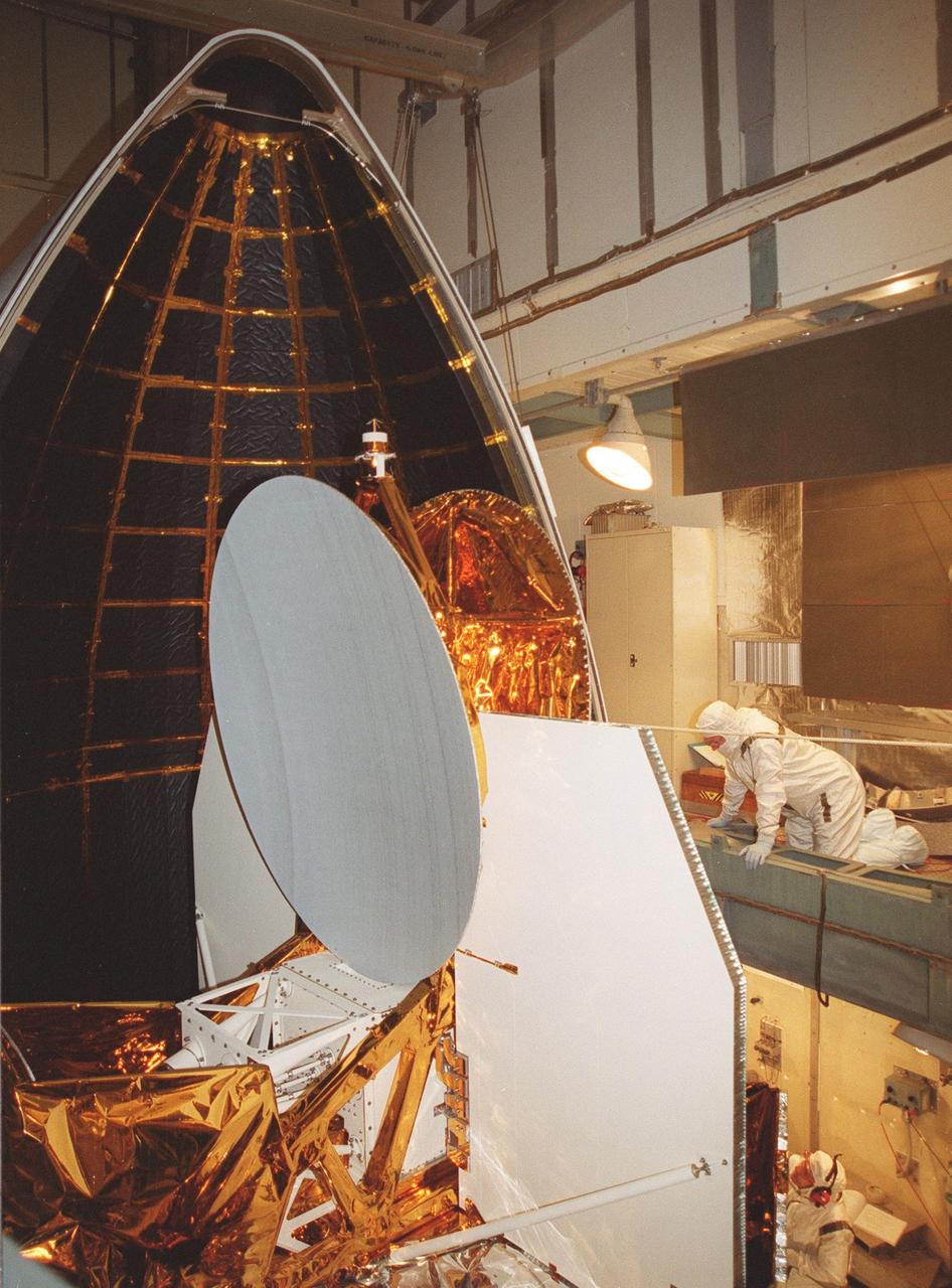 KENNEDY SPACE CENTER, Fla. -- At Launch Complex 17-B, Cape Canaveral Air Force Station, the fairing is moved into position around the Microwave Anisotropy Probe (MAP) spacecraft. MAP is scheduled for launch on June 30 aboard a Boeing Delta II rocket. The launch will place MAP into a lunar-assisted trajectory to the Sun-Earth for a 27-month mission. The probe will measure small fluctuations in the temperature of the cosmic microwave background radiation to an accuracy of one millionth of a degree. These measurements should reveal the size, matter content, age, geometry and fate of the universe. They will also reveal the primordial structure that grew to form galaxies and will test ideas about the origins of these primordial structures. The MAP instrument will be continuously shaded from the Sun, Earth, and Moon by the spacecraft