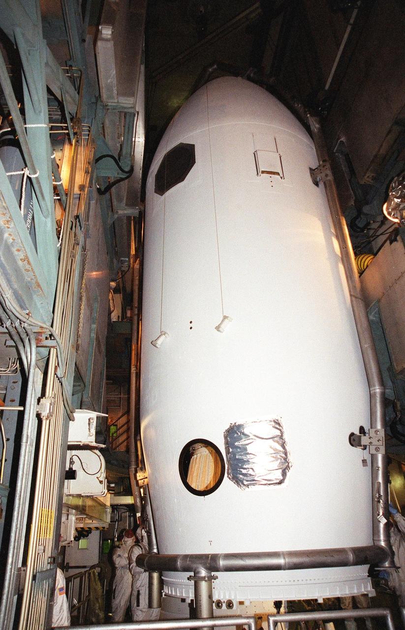 KENNEDY SPACE CENTER, Fla. -- The fairing closes around the Microwave Anisotropy Probe (MAP) spacecraft at Launch Complex 17-B, Cape Canaveral Air Force Station. MAP is scheduled for launch on June 30 aboard a Boeing Delta II rocket. The launch will place MAP into a lunar-assisted trajectory to the Sun-Earth for a 27-month mission. The probe will measure small fluctuations in the temperature of the cosmic microwave background radiation to an accuracy of one millionth of a degree. These measurements should reveal the size, matter content, age, geometry and fate of the universe. They will also reveal the primordial structure that grew to form galaxies and will test ideas about the origins of these primordial structures. The MAP instrument will be continuously shaded from the Sun, Earth, and Moon by the spacecraft