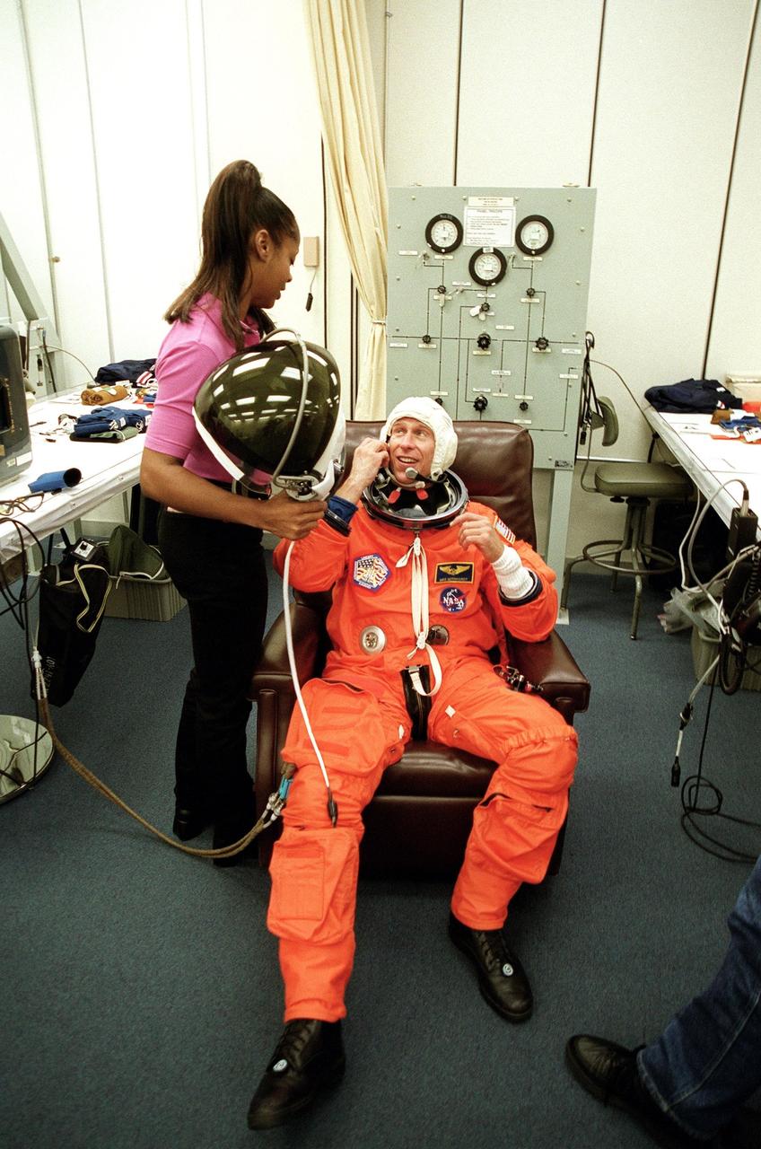 KENNEDY SPACE CENTER, Fla. -- STS-104 Mission Specialist Michael L. Gernhardt has suit and fit check during Terminal Countdown Demonstration Test (TCDT) activities at KSC. The TCDT provides the crew with emergency egress training, opportunities to inspect their mission payloads in Space Shuttle Atlantis’s payload bay, and simulated countdown exercises. Other crew members participating are Commander Steven W. Lindsey, Pilot Charles O. Hobaugh and Mission Specialists Janet Lynn Kavandi and James F. Reilly. The launch of Atlantis on mission STS-104 is scheduled no earlier than July 12 from Launch Pad 39B. The mission is the 10th flight to the International Space Station and carries the Joint Airlock Module