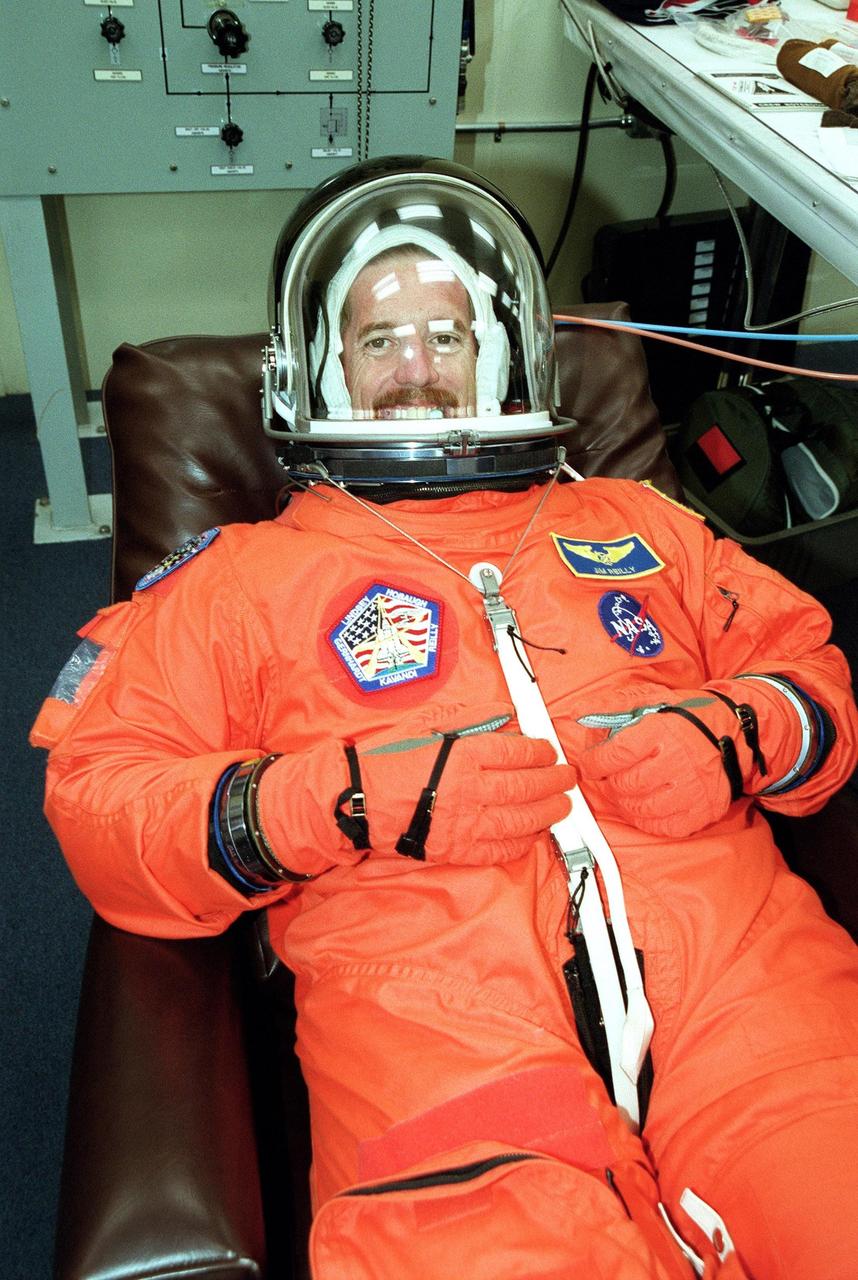KENNEDY SPACE CENTER, Fla. -- STS-104 Mission Specialist James F. Reilly is happy to be going through suit and fit check during Terminal Countdown Demonstration Test (TCDT) activities at KSC. The TCDT provides the crew with emergency egress training, opportunities to inspect their mission payloads in Space Shuttle Atlantis’s payload bay, and simulated countdown exercises. Other crew members participating are Commander Steven W. Lindsey, Pilot Charles O. Hobaugh and Mission Specialists Janet Lynn Kavandi and Michael L. Gernhardt. The launch of Atlantis on mission STS-104 is scheduled no earlier than July 12 from Launch Pad 39B. The mission is the 10th flight to the International Space Station and carries the Joint Airlock Module