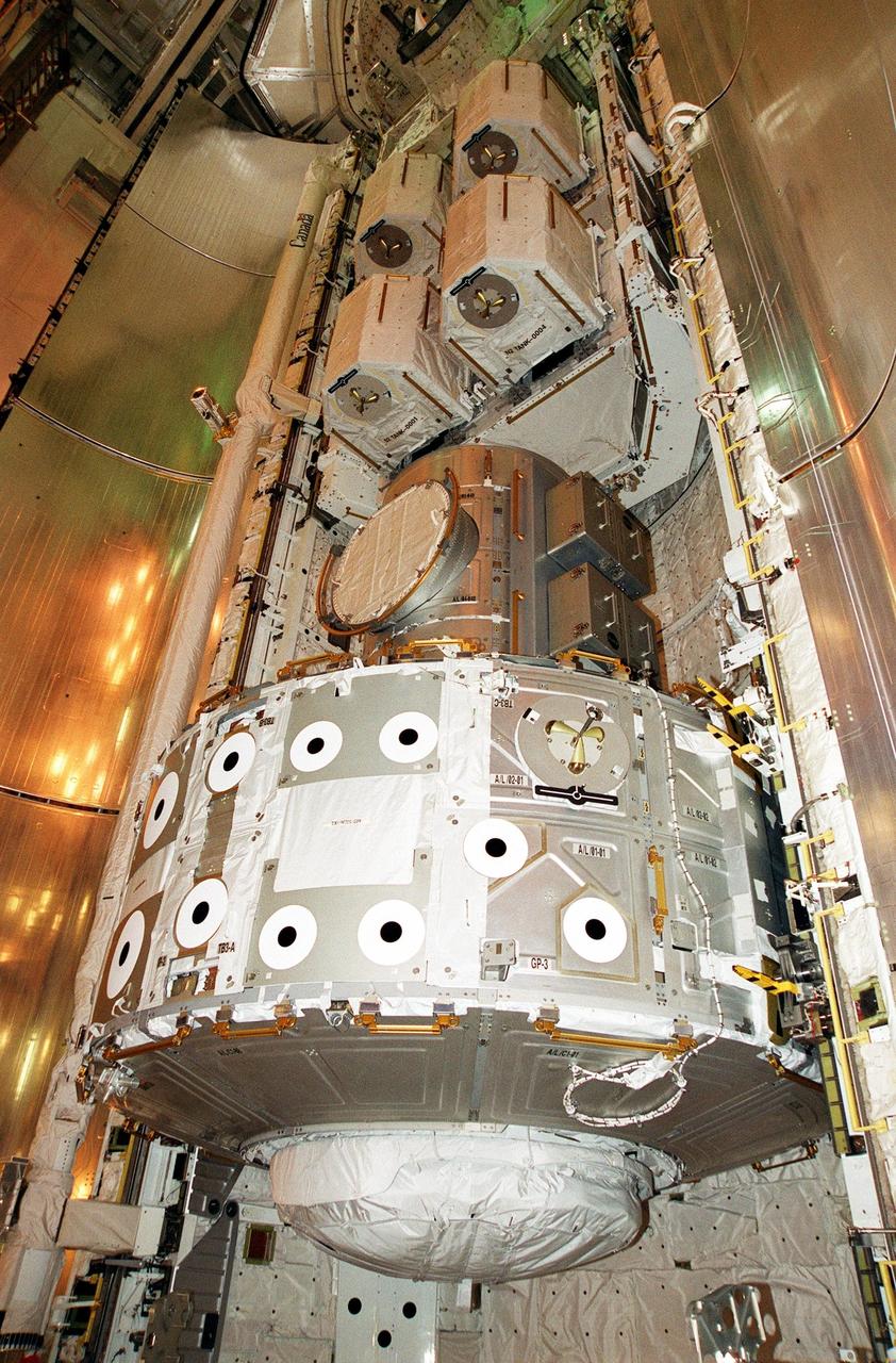 KENNEDY SPACE CENTER, Fla. -- Resting inside Atlantis’s payload bay are the Joint Airlock Module (bottom) and pallet containing the high pressure gas assembly (above). Both are heading for the International Space Station on mission STS-104, scheduled to be launched July 12. The module, which comprises a crew lock and an equipment lock, will be connected to the starboard (right) side of Node 1 Unity. Once installed and activated, the Airlock becomes the primary path for Space Station spacewalk entry and departure for U.S. spacesuits, which are known as Extravehicular Mobility Units, or EMUs. In addition, the Joint Airlock is designed to support the Russian Orlan spacesuit for EVA activity. The high pressure gas assembly will support future spacewalk operations from the Space Station and augment the Service Module gas resupply system