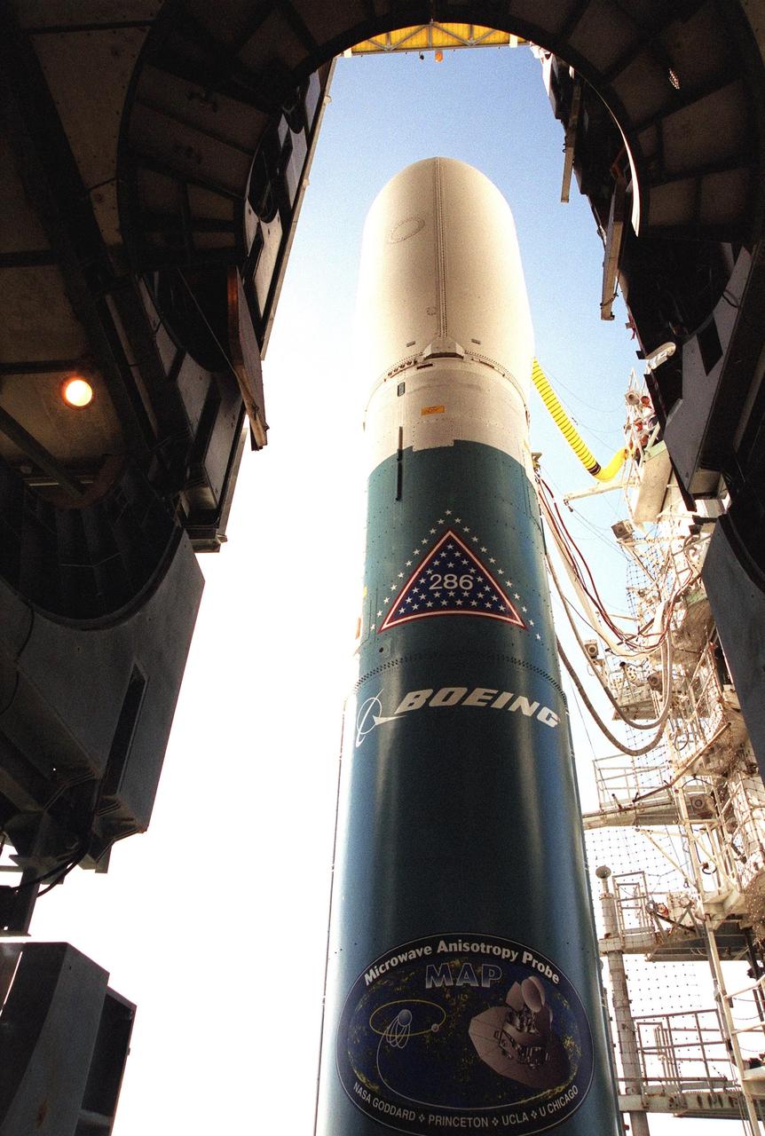 KENNEDY SPACE CENTER, Fla. -- The Boeing Delta II rocket is poised for flight on Launch Complex 17-A, Cape Canaveral Air Force Station, after rollback of the Mobile Service Tower. Topping the rocket is the payload, the Microwave Anisotropy Probe (MAP) spacecraft. Launch is scheduled at 3:46 p.m. EDT June 30. The launch will place MAP into a lunar-assisted trajectory to the Sun-Earth for a 27-month mission. The probe will measure small fluctuations in the temperature of the cosmic microwave background radiation to an accuracy of one millionth of a degree. These measurements should reveal the size, matter content, age, geometry and fate of the universe. They will also reveal the primordial structure that grew to form galaxies and will test ideas about the origins of these primordial structures. The MAP instrument will be continuously shaded from the Sun, Earth, and Moon by the spacecraft. The probe is a product of Goddard Space Flight Center in partnership with Princeton University