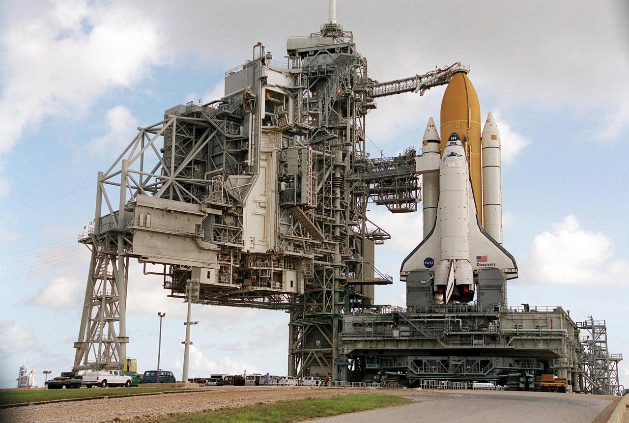 KENNEDY SPACE CENTER, Fla. -- Space Shuttle Discovery arrives at Launch Pad 39A after an early morning rollout from the Vehicle Assembly Building. Discovery is scheduled to launch Aug. 3 on mission STS-105
