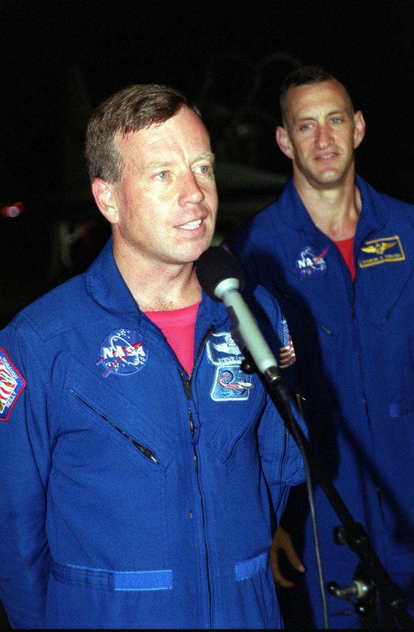 KENNEDY SPACE CENTER, Fla. -- After arriving at the Shuttle Landing Facility, the STS-104 crew stopped to talk to the media. At the microphone is Commander Steven W. Lindsey; at right is Pilot Charles O. Hobaugh. The crew is at KSC to make final preparations for their launch. Other crew members are Mission Specialists James F. Reilly, Janet Lynn Kavandi and Michael L. Gernhardt. The launch of Atlantis on mission STS-104 is scheduled for July 12 from Launch Pad 39B. The mission is the 10th assembly flight to the International Space Station and carries the Joint Airlock Module, which will become the primary path for spacewalk entry and departure using both U.S. spacesuits and the Russian Orlan spacesuit for EVA activity