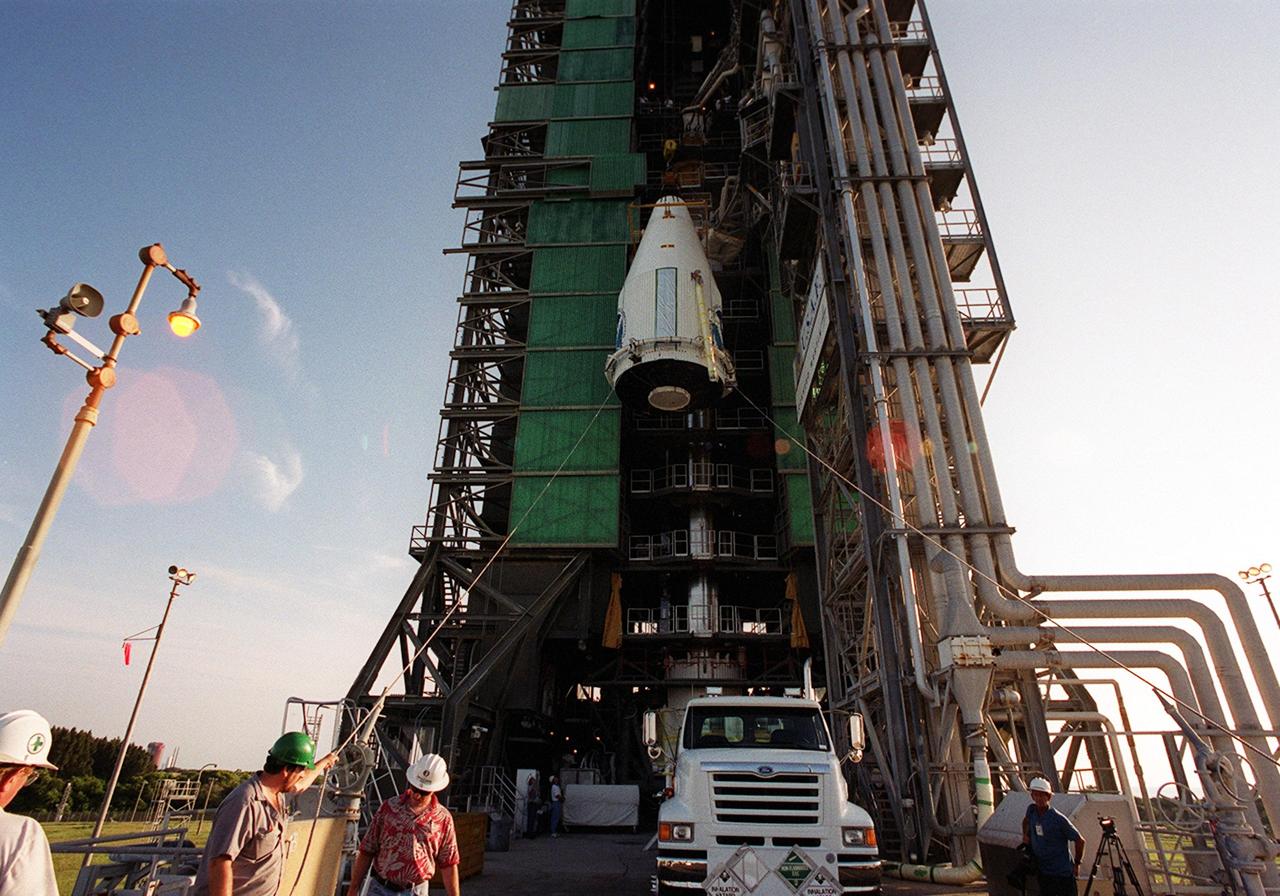 KENNEDY SPACE CENTER, Fla. -- The GOES-M satellite is lifted up the launch tower at Complex 36-A, Cape Canaveral Air Force Station. GOES-M is the last in the current series of advanced geostationary weather satellites in service. GOES-M has a new instrument not on earlier spacecraft, a Solar X-ray Imager, which can be used in forecasting space weather and the effects of solar storms. The satellite is scheduled to launch atop an Atlas rocket July 15