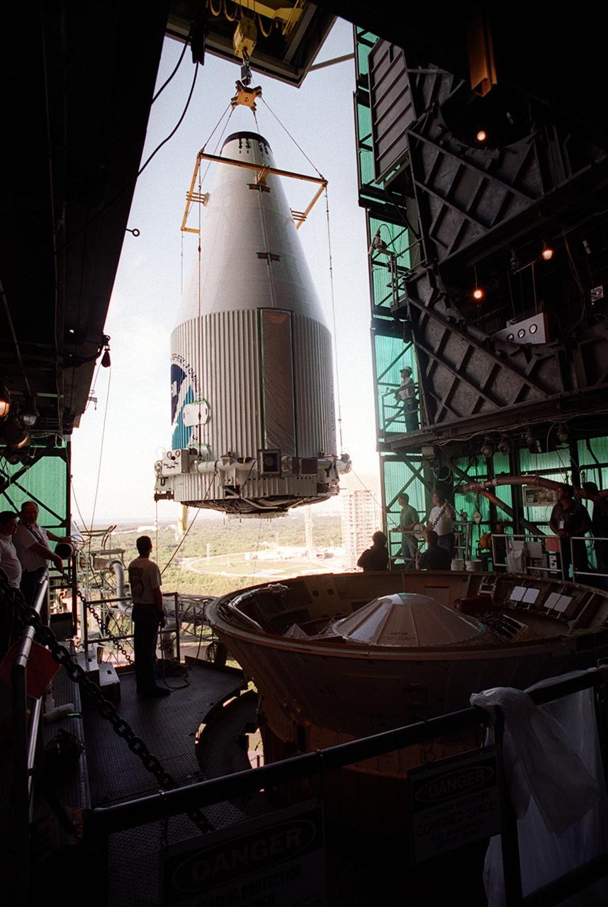 KENNEDY SPACE CENTER, Fla. -- The GOES-M satellite is moved toward the Atlas rocket in the launch tower at Complex 36-A, Cape Canaveral Air Force Station. GOES-M is the last in the current series of advanced geostationary weather satellites in service. GOES-M has a new instrument not on earlier spacecraft, a Solar X-ray Imager, which can be used in forecasting space weather and the effects of solar storms. The satellite is scheduled to launch atop an Atlas rocket July 15.