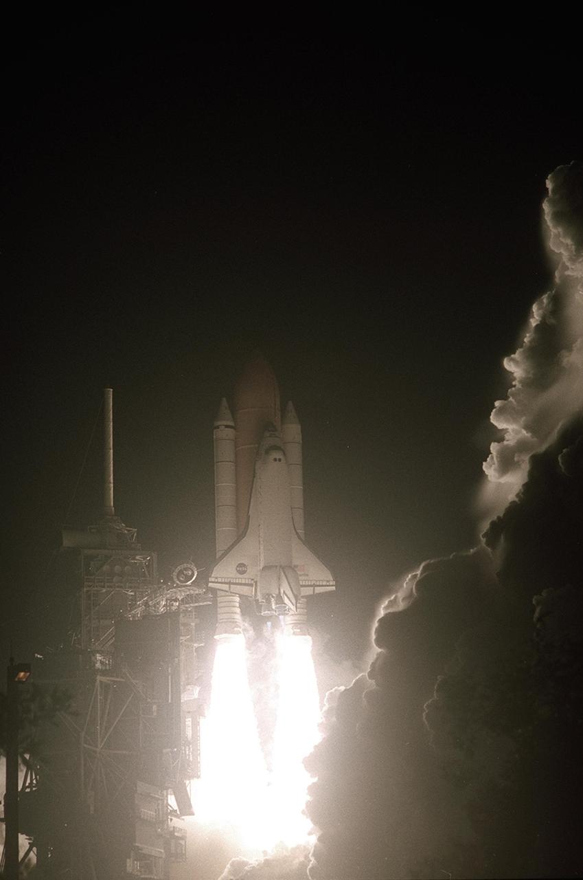 KENNEDY SPACE CENTER, Fla. -- Space Shuttle Atlantis appears to leap from a fiery ball as it hurtles into the pre-dawn sky on mission STS-104. Atlantis lifted off from Launch Pad 39B on time at 5:03:59 a.m. EDT. With a crew of five, it is heading on the 10th assembly flight to the International Space Station. The primary payload on the mission is the joint airlock module, which will require two spacewalks to attach it to the Space Station. The airlock will be the primary path for Space Station spacewalk entry and departure for U.S. spacesuits, and will also support the Russian Orlan spacesuit for EVA activity
