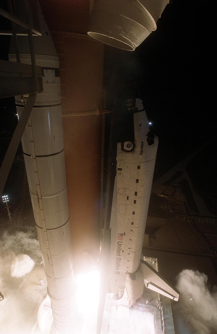 KENNEDY SPACE CENTER, Fla. -- Space Shuttle Atlantis begins its trek to the International Space Station as it lifts off the pad with a crew of five on mission STS-104. Atlantis lifted off from Launch Pad 39B on time at 5:03:59 a.m. EDT. The 10th assembly flight to the International Space Station, the primary payload on the mission is the joint airlock module, which will require two spacewalks to attach it to the Space Station. The airlock will be the primary path for Space Station spacewalk entry and departure for U.S. spacesuits, and will also support the Russian Orlan spacesuit for EVA activity