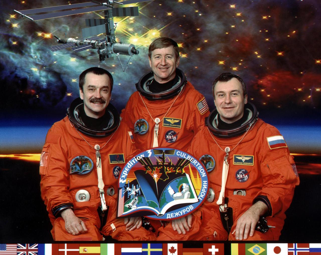 JOHNSON SPACE CENTER, HOUSTON, TEXAS -- (ISS03-5-002) --EXPEDITION  THREE CREW PORTRAIT -- Taking a break from a busy training schedule to pose for a portrait are the crew members for Expedition Three, scheduled to replace the current cosmonaut/astronaut trio aboard the International Space Station (ISS).  Astronaut Frank L. Culbertson Jr. (center), commander, is flanked by cosmonauts Mikhail Tyurin (left) and Vladimir Dezhurov, both flight engineers representing Rosaviakosmos.  The three will accompany the STS-105 crew into Earth orbit aboard the Space Shuttle Discovery this summer to begin their lengthy stay on the orbital outpost