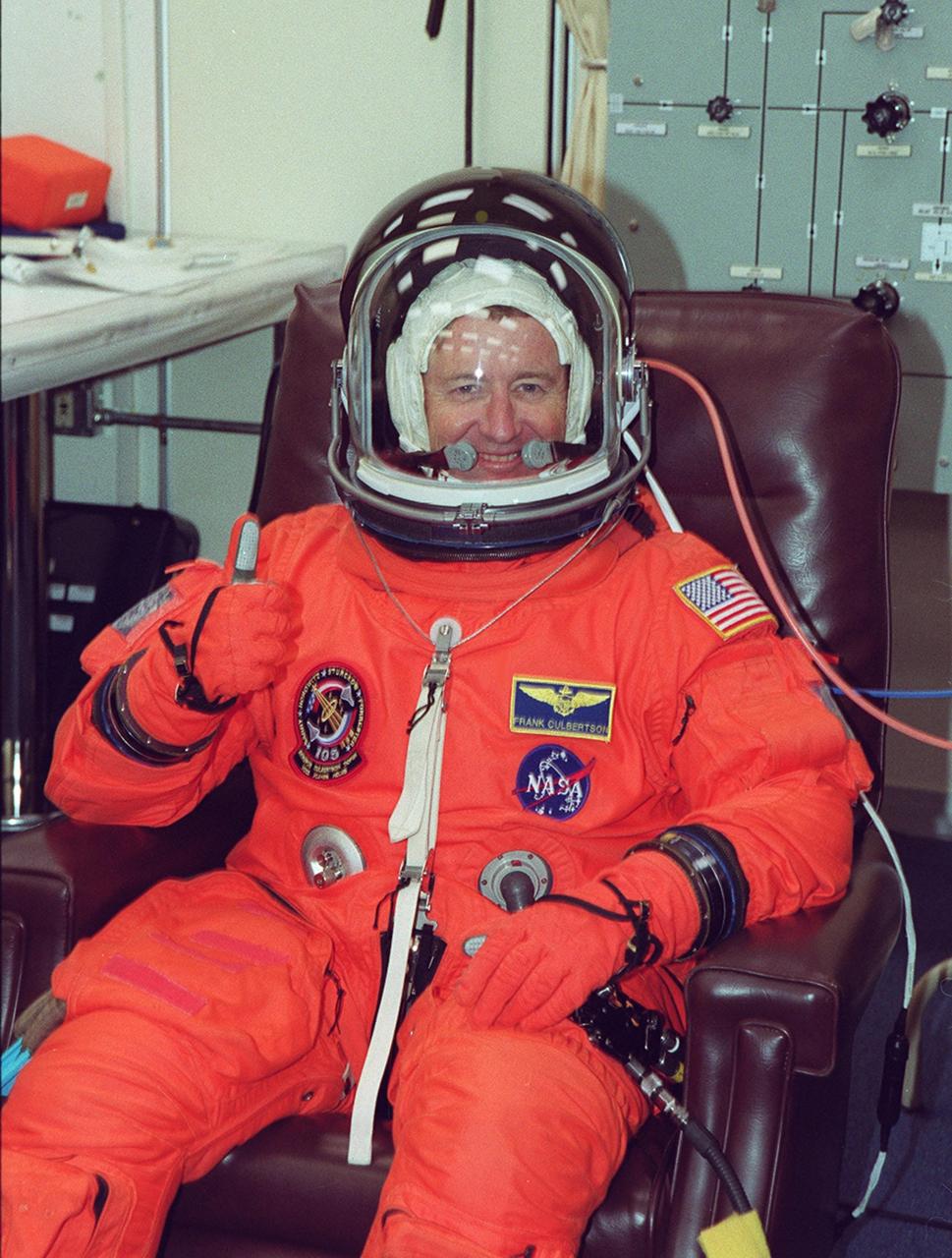 KENNEDY SPACE CENTER, Fla. -- Expedition Three Commander Frank Culbertson happily sits through suit fit check as part of Terminal Countdown Demonstration Test activities. He and fellow crew members Vladimir Nikolaevich Dezhurov and Mikhail Tyurin, both with the Russian Aviation and Space Agency, are taking part in the TCDT along with the STS-105 crew: Commander Scott Horowitz, Pilot Rick Sturckow, and Mission Specialists Daniel Barry and Patrick Forrester. The TCDT also includes emergency egress training and a simulated launch countdown. Mission STS-105 will be transporting the Expedition Three crew, several payloads and scientific experiments to the International Space Station aboard Space Shuttle Discovery. The current Expedition Two crew members on the Station will return to Earth on Discovery. Launch of Discovery is scheduled no earlier than Aug. 9, 2001