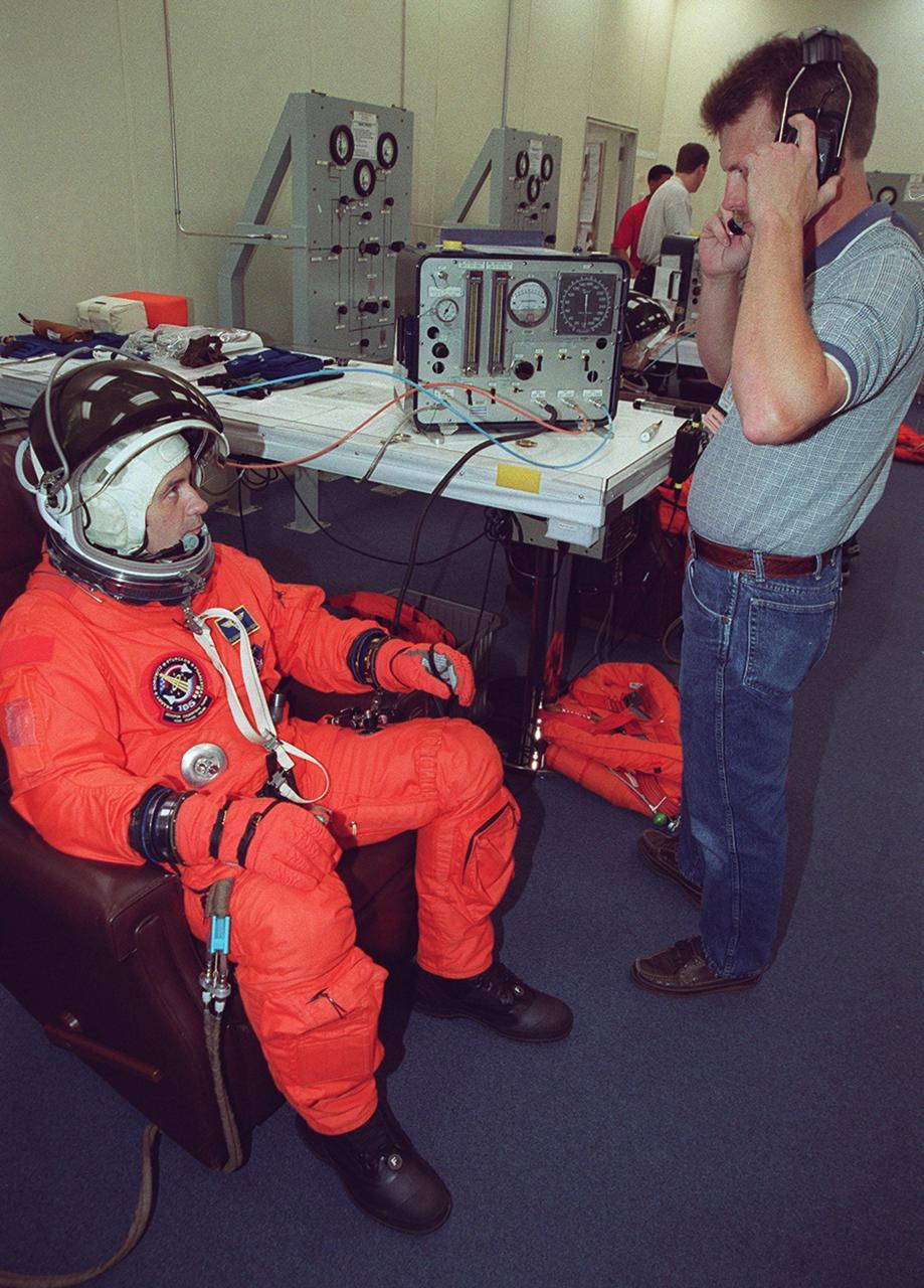 KENNEDY SPACE CENTER, Fla. -- Expedition Three crew member Vladimir Nikolaevich Dezhurov undergoes suit fit check as part of Terminal Countdown Demonstration Test activities. He and fellow crew members Commander Frank Culbertson and Mikhail Tyurin are taking part in the TCDT along with the STS-105 crew: Commander Scott Horowitz, Pilot Rick Sturckow, and Mission Specialists Daniel Barry and Patrick Forrester. Dezhurov and Tyurin are both with the Russian Aviation and Space Agency. The TCDT also includes emergency egress training and a simulated launch countdown. Mission STS-105 will be transporting the Expedition Three crew, several payloads and scientific experiments to the International Space Station aboard Space Shuttle Discovery. The current Expedition Two crew members on the Station will return to Earth on Discovery. Launch of Discovery is scheduled no earlier than Aug. 9, 2001