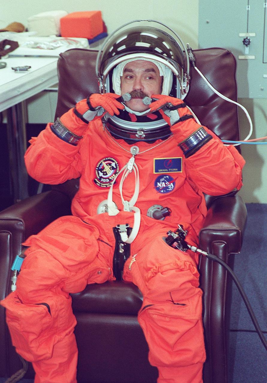 KENNEDY SPACE CENTER, Fla. -- Expedition Three crew member Mikhail Tyurin undergoes suit fit check as part of Terminal Countdown Demonstration Test activities. He and fellow crew members Commander Frank Culbertson and Vladimir Nikolaevich Dezhurov are taking part in the TCDT along with the STS-105 crew: Commander Scott Horowitz, Pilot Rick Sturckow, and Mission Specialists Daniel Barry and Patrick Forrester. Dezhurov and Tyurin are both with the Russian Aviation and Space Agency. The TCDT also includes emergency egress training and a simulated launch countdown. Mission STS-105 will be transporting the Expedition Three crew, several payloads and scientific experiments to the International Space Station aboard Space Shuttle Discovery. The current Expedition Two crew members on the Station will return to Earth on Discovery. Launch of Discovery is scheduled no earlier than Aug. 9, 2001