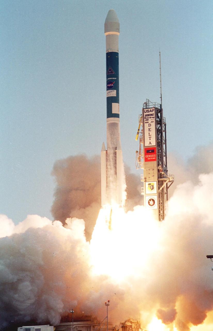KENNEDY SPACE CENTER, Fla. -- Smoke and steam rolls engulfs the launch tower at Launch Complex 17-A, Cape Canaveral Air Force Station, as the Boeing Delta II rocket propels NASA’s Genesis spacecraft into the sky. The Genesis/Delta launch occurred on time at 12:13:40 p.m. EDT. Genesis is on a journey to collect and return to Earth just 10 to 20 micrograms of solar wind, invisible charged particles that flow outward from the Sun. The particles will be studied by scientists over the next century to search for answers to fundamental questions about the exact composition of our star and the birth of our solar system