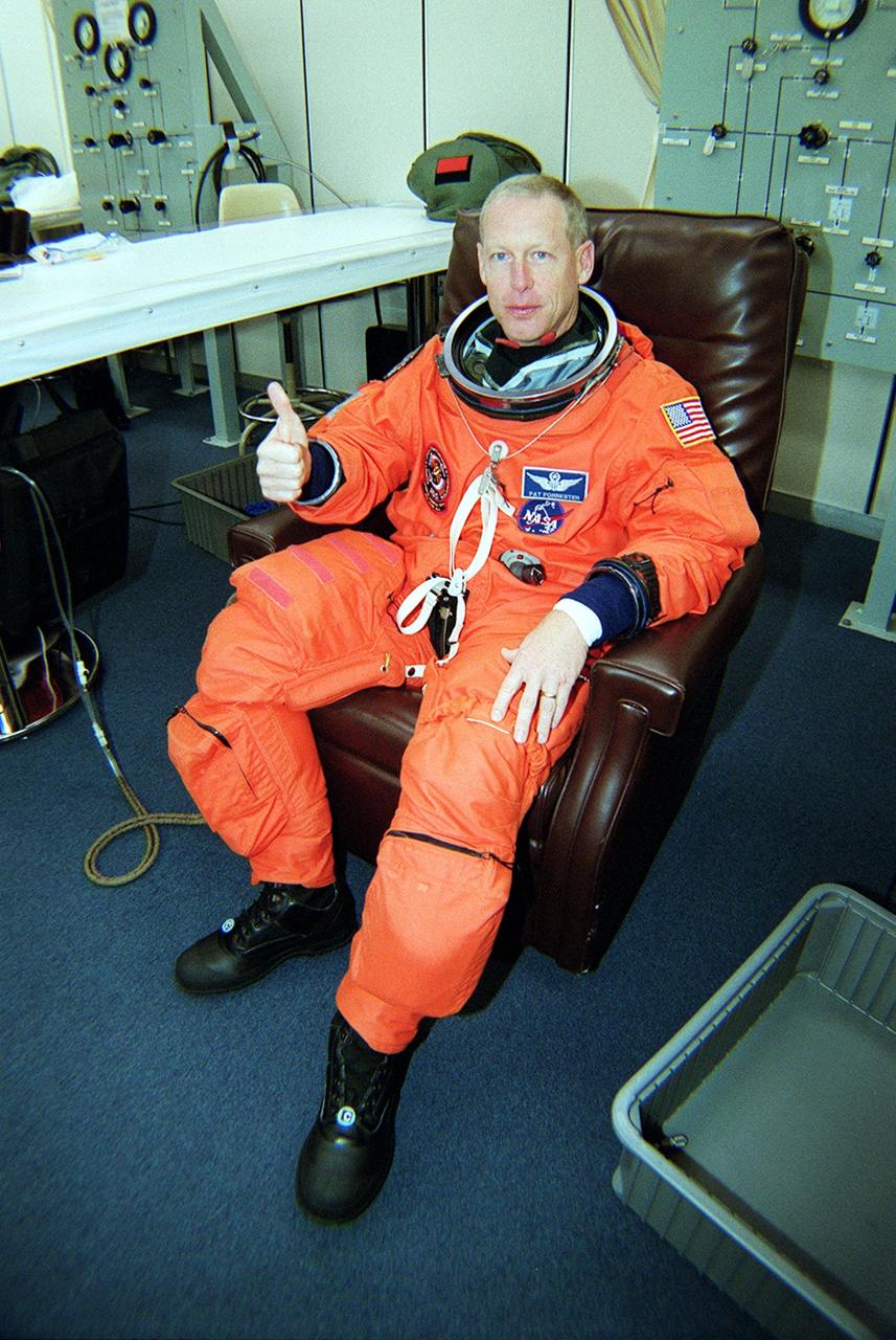 KENNEDY SPACE CENTER, Fla. -- STS-105 Mission Specialist Patrick Forrester suits up for launch on mission STS-105. The mission is Forrester’s first space flight. On the mission, Discovery will be transporting the Expedition Three crew and several scientific experiments and payloads to the International Space Station, including the Early Ammonia Servicer (EAS) tank. The EAS, which will support the thermal control subsystems until a permanent system is activated, will be attached to the Station during two spacewalks. The three-member Expedition Two crew will be returning to Earth aboard Discovery after a five-month stay on the Station. Launch is scheduled for 5:38 p.m. EDT Aug. 9