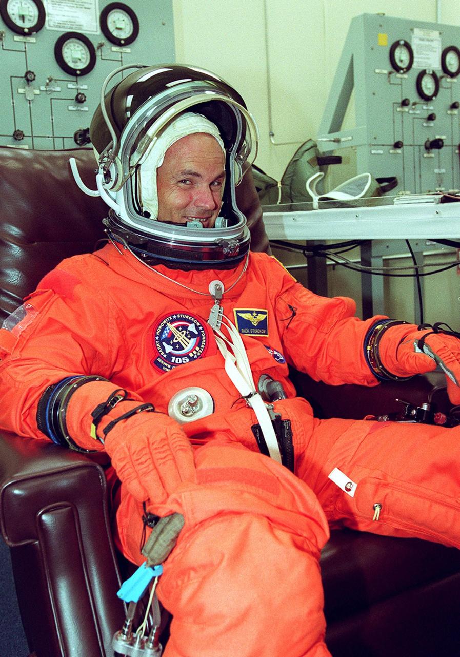 KENNEDY SPACE CENTER, Fla. -- STS-105 Pilot Rick Sturckow happy to get ready for the second launch attempt after a 24-hour weather delay. Launch countdown activities for the 12-day mission were called off at about 5:12 p.m. Aug. 9 during the T-9 minute hold due to the high potential for lightning, a thick cloud cover and the potential for showers. Launch is currently scheduled for 5:15 p.m. EDT Aug. 10. Highlighting the mission will be the rotation of the International Space Station crew, the third flight of an Italian-built Multi-Purpose Logistics Module delivering additional scientific racks, equipment and supplies for the Space Station, and two spacewalks. Included in the payload is the Early Ammonia Servicer (EAS) tank, which will be attached to the Station during the spacewalks. The EAS will be installed on the P6 truss, which holds the Station’s giant U.S. solar arrays, batteries and the cooling radiators. The EAS contains spare ammonia for the Station’s cooling system. The three-member Expedition Two crew will be returning to Earth aboard Discovery after a five-month stay on the Station