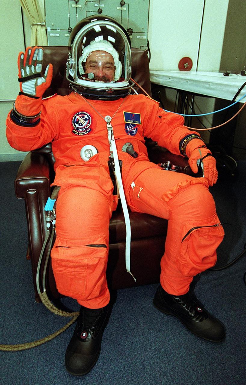 KENNEDY SPACE CENTER, Fla. -- Expedition Three cosmonaut Mikhail Tyurin is eager for the second launch attempt of mission STS-105 after a 24-hour weather delay. This is Tyurin’s first space flight. Launch countdown activities for the 12-day mission were called off at about 5:12 p.m. Aug. 9 during the T-9 minute hold due to the high potential for lightning, a thick cloud cover and the potential for showers. Launch is currently scheduled for 5:15 p.m. EDT Aug. 10. Highlighting the mission will be the rotation of the International Space Station crew, the third flight of an Italian-built Multi-Purpose Logistics Module delivering additional scientific racks, equipment and supplies for the Space Station, and two spacewalks. Included in the payload is the Early Ammonia Servicer (EAS) tank, which will be attached to the Station during the spacewalks. The EAS will be installed on the P6 truss, which holds the Station’s giant U.S. solar arrays, batteries and the cooling radiators. The EAS contains spare ammonia for the Station’s cooling system. The three-member Expedition Two crew will be returning to Earth aboard Discovery after a five-month stay on the Station