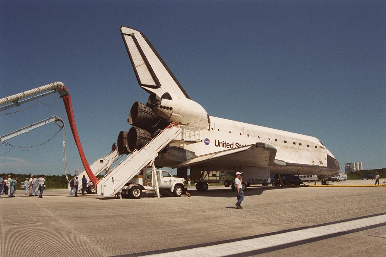 KENNEDY SPACE CENTER, Fla. -- On KSC’s Shuttle Landing Facility runway 15 following mission STS-105, orbiter Discovery undergoes safing operations such as being checked for toxic or hazardous gases, and having purge air introduced to cool the vehicle and humidified air conditioning to the payload bay and other cavities to remove any residual explosive or toxic fumes that may be present. The operations include preparing the orbiter for ground tow operations, installing switch guards and removing data packages from any onboard experiments. Main gear touchdown was at 2:22:58 p.m. EDT; wheel stop, at 2:24:06 p.m. EDT. The 11-day, 21-hour, 12-minute mission accomplished the goals set for the 11th flight to the International Space Station: swapout of the resident Station crew; delivery of equipment, supplies and scientific experiments; and installation of the Early Ammonia Servicer and heater cables for the S0 truss on the Station. Discovery traveled 4.3 million miles on its 30th flight into space, the 106th mission of the Space Shuttle program. Out of five missions in 2001, the landing was the first to occur in daylight at KSC