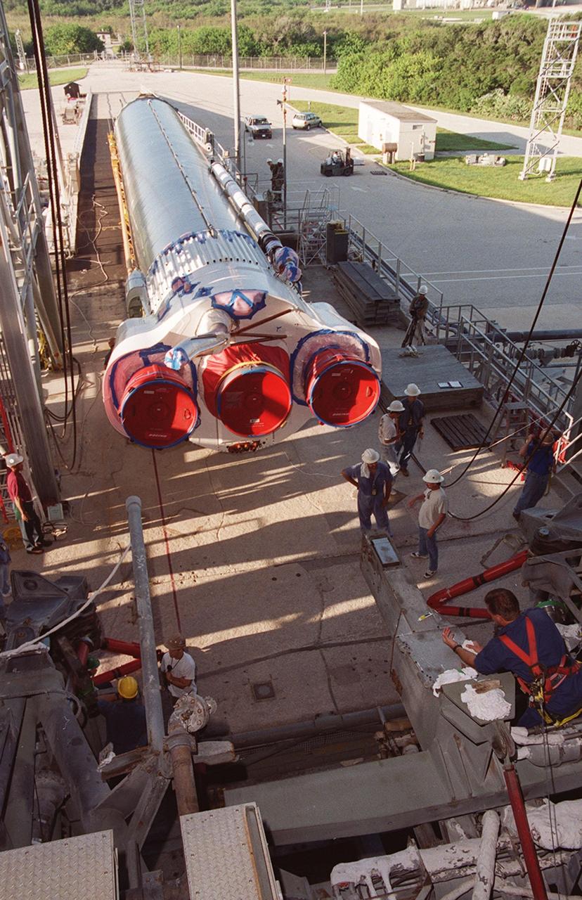 KENNEDY SPACE CENTER, Fla. -- The first (booster) stage of an Atlas II rocket arrives at Pad 36-A, Cape Canaveral Air Force Station. The segment will be lifted and raised into the launch tower where it will be mated with the Tracking and Data Relay Satellite, known as TDRS-I, for launch in January 2002. The TDRS System (TDRSS) is a communication signal relay system that provides tracking and data acquisition services between low-Earth orbiting spacecraft and NASA/customer control and/or data processing facilities. The system is capable of transmitting to and receiving data from customer spacecrafts over 100 percent of their orbit (some limitations may apply depending on actual orbit). The TDRS-I provides a Ka-band service that will allow customers with extremely high data rates to be supported by the Tracking and Data Relay Satellite System (TDRSS) if they desire
