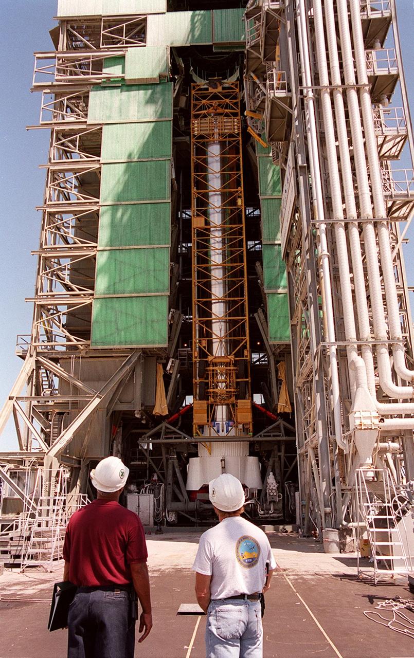 KENNEDY SPACE CENTER, Fla. -- The first (booster) stage of an Atlas II rocket is moved into the launch tower at Pad 36-A, Cape Canaveral Air Force Station. It will later be mated with the Tracking and Data Relay Satellite, known as TDRS-I, for launch in January 2002. The TDRS System (TDRSS) is a communication signal relay system that provides tracking and data acquisition services between low-Earth orbiting spacecraft and NASA/customer control and/or data processing facilities. The system is capable of transmitting to and receiving data from customer spacecrafts over 100 percent of their orbit (some limitations may apply depending on actual orbit). The TDRS-I provides a Ka-band service that will allow customers with extremely high data rates to be supported by the Tracking and Data Relay Satellite System (TDRSS) if they desire