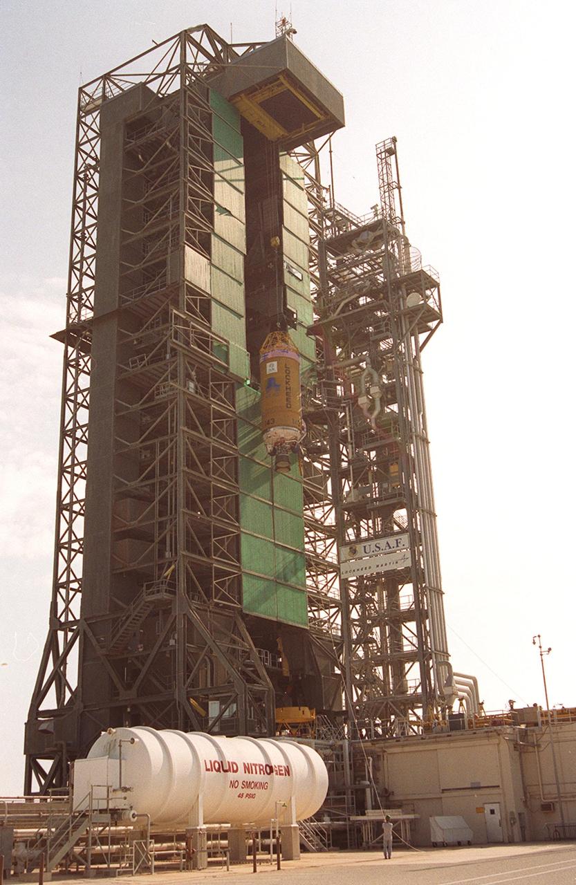 KENNEDY SPACE CENTER, Fla. -- The Lockheed Martin Atlas/Centaur segment of the Atlas II rocket is lifted up the launch tower at Launch Pad 36-A, Cape Canaveral Air Force Station. The rocket is scheduled to launch the Tracking and Data Relay Satellite, known as TDRS-I, in January 2002. The TDRS System (TDRSS) is a communication signal relay system that provides tracking and data acquisition services between low-Earth orbiting spacecraft and NASA/customer control and/or data processing facilities. The system is capable of transmitting to and receiving data from customer spacecrafts over 100 percent of their orbit (some limitations may apply depending on actual orbit). The TDRS-I provides a Ka-band service that will allow customers with extremely high data rates to be supported by the Tracking and Data Relay Satellite System (TDRSS) if they desire.