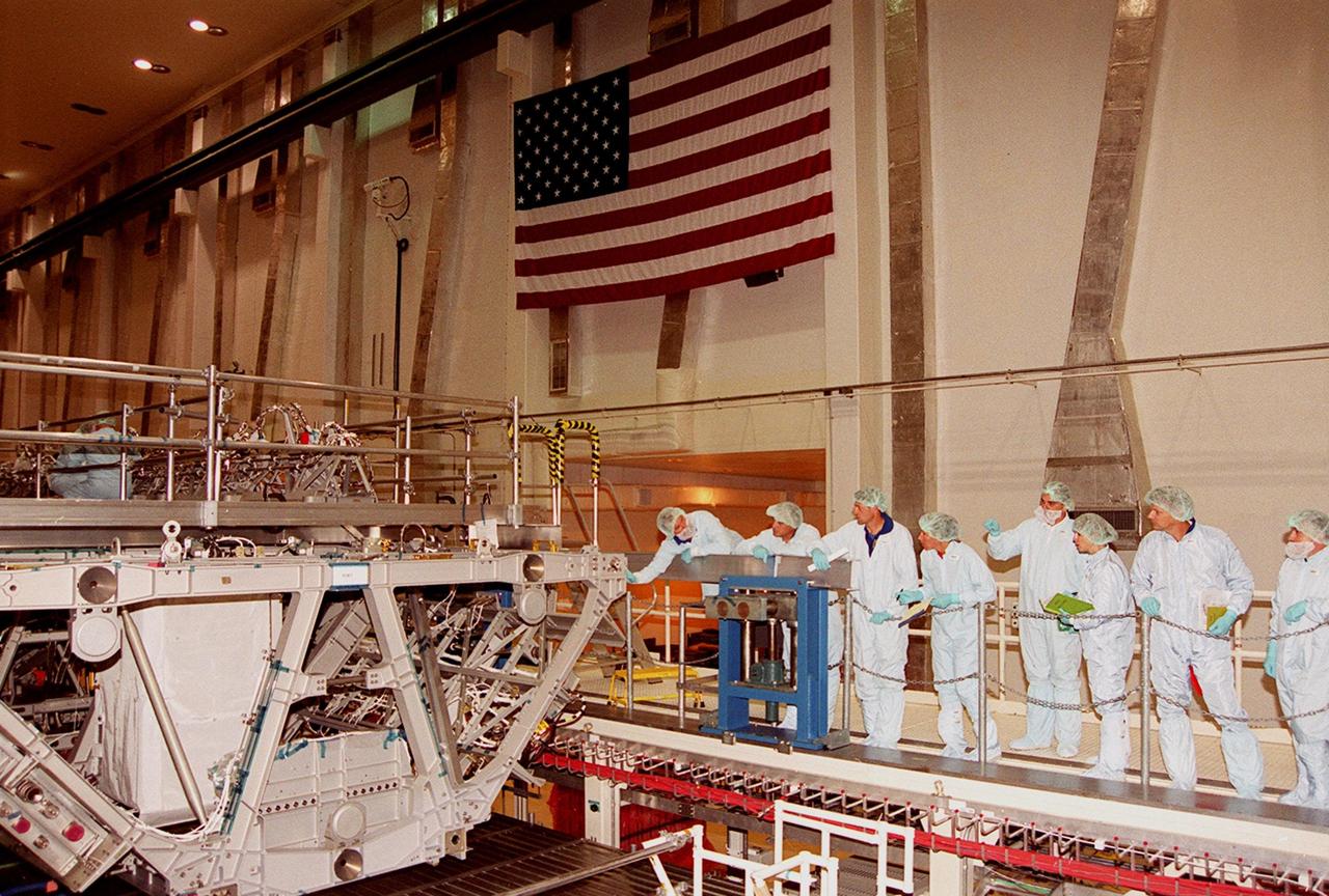 KENNEDY SPACE CENTER, Fla. -- In the Operations and Checkout Bldg,, members of the STS-112 crew look over the Integrated Truss Structure (ITS) S1 that will be part of the payload on the mission. The crew comprises Commander Jeffrey S. Ashby, Pilot Pamela A. Melroy and Mission Specialists David A. Wolf, Piers J. Sellers, Sandra H. Magnus and Fyodor Nikolayevich Yurchikhin, a cosmonaut with the Russian Aviation and Space Agency. Mission STS-112 is scheduled for launch in July 2002