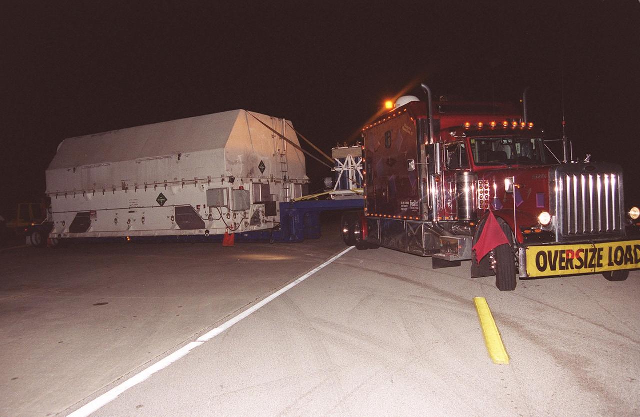 KENNEDY SPACE CENTER, Fla. -- A large truck delivers part of the equipment to be used on mission STS-109, servicing the Hubble Space Telescope, to KSC. The primary servicing tasks of the mission are to replace Solar Array 2 with Solar Array 3, replace the Power Control Unit, remove the Faint Object Camera and install the Advanced Camera for Surveys, install the NICMOS Cooling System, and install New Outer Blanket Insulation on bays 5 through 8. Mission STS-109 is scheduled for launch in mid-February 2002