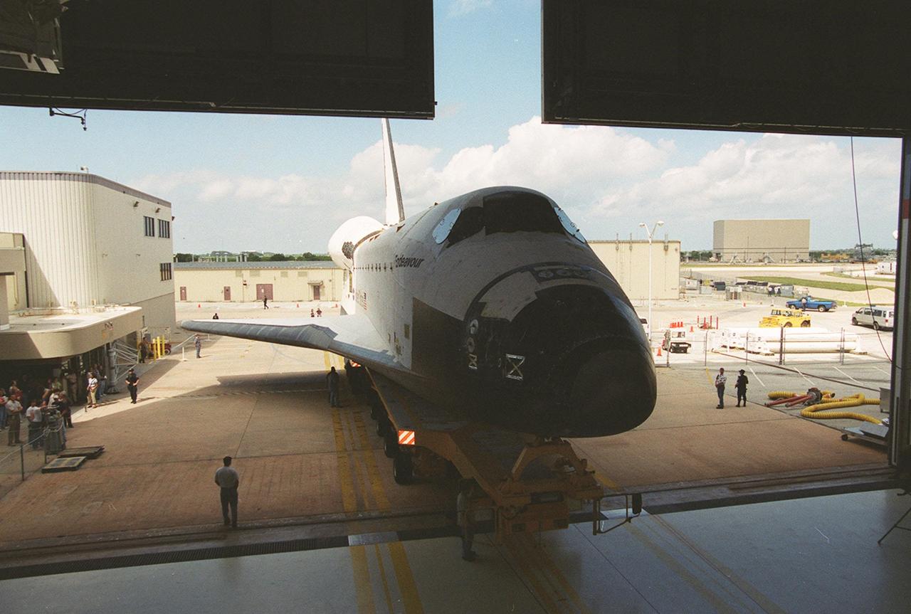 KENNEDY SPACE CENTER, Fla. -- Endeavour rolls out of the Orbiter Processing Facility to begin the next stage of launch preparation: stacking with the external tank and solid rocket boosters. Endeavour is scheduled to be launched Nov. 29 on mission STS-108. The 11-day mission will carry the replacement Expedition 4 crew to the International Space Station as well as the Multi-Purpose Logistics Module Raffaello, filled with supplies and equipment.