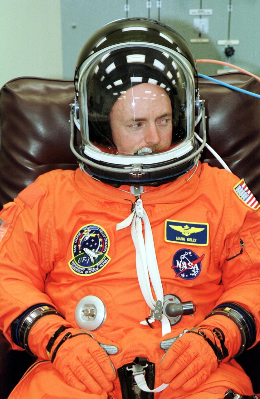 KENNEDY SPACE CENTER, Fla. --  STS-108 Pilot Mark E. Kelly undergoes suit and pre-pack fit check prior to taking part in a simulated launch countdown.   Kelly and other crew members are at KSC for Terminal Countdown Demonstration Test activities that also include emergency exit training from the orbiter and launch pad. STS-108 is a Utilization Flight that will carry the replacement Expedition 4 crew to the International Space Station, as well as the Multi-Purpose Logistics Module Raffaello, filled with supplies and equipment.  The l1-day mission is scheduled for launch Nov. 29 on Space Shuttle Endeavour.