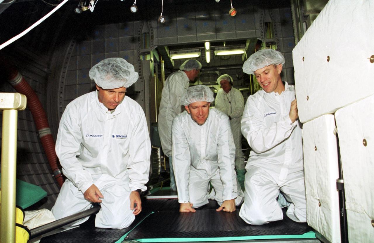 KENNEDY SPACE CENTER, Fla. -- At SPACEHAB in Cape Canaveral, Fla., members of the STS-107 crew pose outside of the Double Module, one of the mission payloads.  From left to right are Mission Specialist David Brown, Commander Rick D. Husband, Pilot William "Willie" McCool and Payload Specialist Ilan Ramon, from Israel. A research mission, the mission will be the first flight of  the Double Module and will also carry a Hitchhiker payload.  The experiments range from material sciences to life sciences (many rats).  The Hitchhiker carrier system is modular and expandable in accordance with payload requirements. Hitchhiker experiments are housed in canisters or attached to mounting plates. The Hitchhiker canister comes in two varieties--the Hitchhiker Motorized Door Canister and the Sealed Canisters