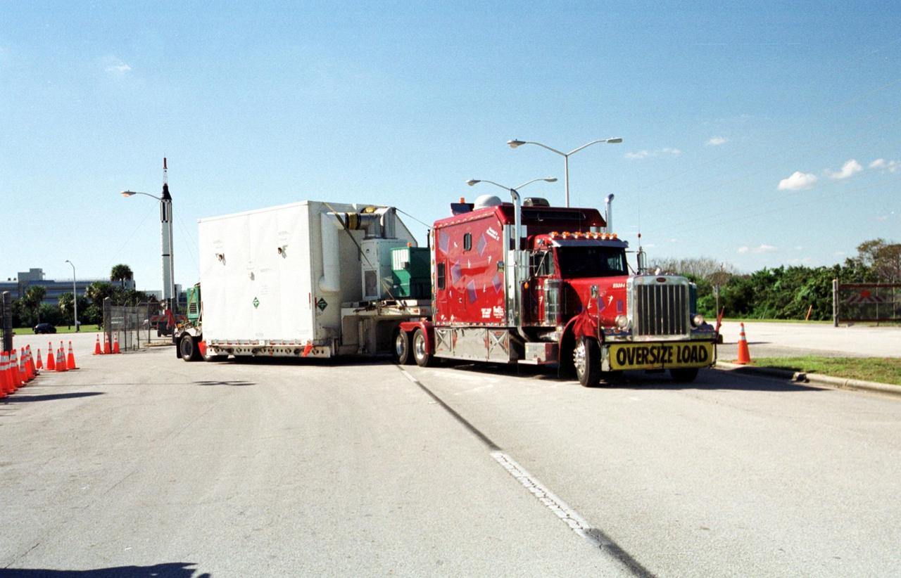 KENNEDY SPACE CENTER, Fla. -- A large truck arrives at the gate to KSC, delivering part of the equipment to be used on mission STS-109, the Hubble Servicing mission. The primary tasks of the mission are to replace Solar Array 2 with Solar Array 3, replace the Power Control Unit, remove the Faint Object Camera and install the Advanced Camera for Surveys, install the Near Infrared Camera and Multi-Object Spectrometer (NICMOS) Cooling System, and install New Outer Blanket Layer insulation on bays 5 through 8. Mission STS-109 is scheduled for launch Feb. 14, 2002