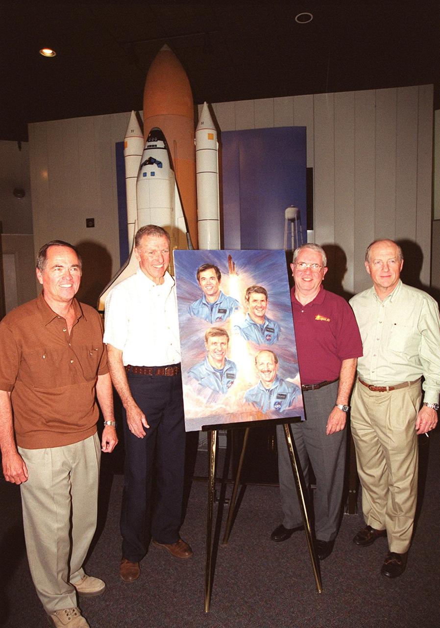 KENNEDY SPACE CENTER, Fla. -- The 2001 inductees into the Astronaut Hall of Fame gather around a drawing of all four. From left, Robert Crippen, Joe Engle, Richard Truly and Frederick "Rick" Hauck were honored as the first four Shuttle astronauts in a ceremony at the KSC Visitor Complex Nov. 10